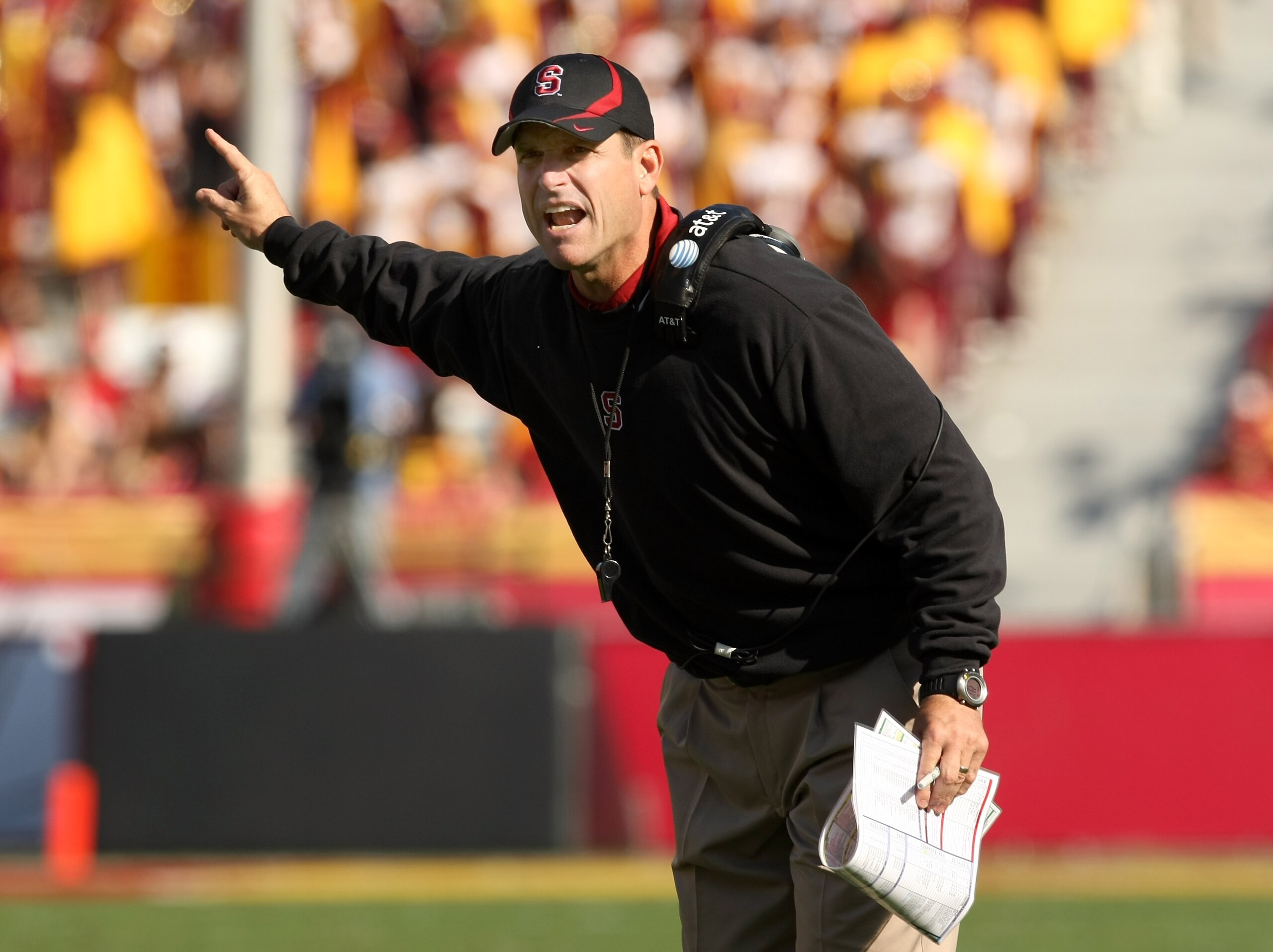 LOS ANGELES, CA - NOVEMBER 14:  Head coach Jim Harbaugh of the Stanford Cardinal signals during the game with the USC Trojans on November 14, 2009 at the Los Angeles Coliseum in Los Angeles, California.  Stanford won 55-21.  (Photo by Stephen Dunn/Getty I