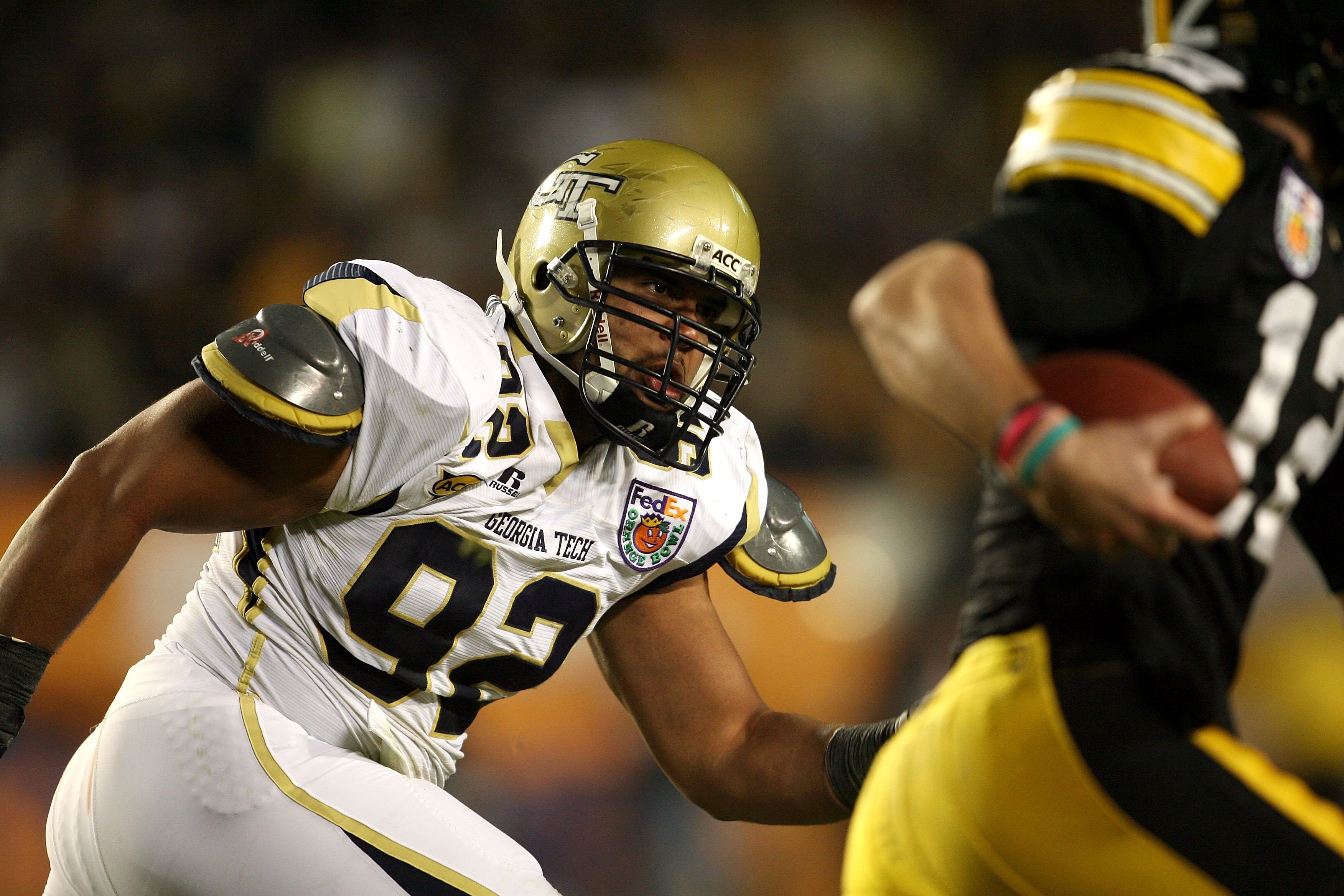 MIAMI GARDENS, FL - JANUARY 05:  Defensive lineman Jason Peters #92 of the Georgia Tech Yellow Jackets pressures the quarterback against the Iowa Hawkeyes during the FedEx Orange Bowl at Land Shark Stadium on January 5, 2010 in Miami Gardens, Florida. Iow