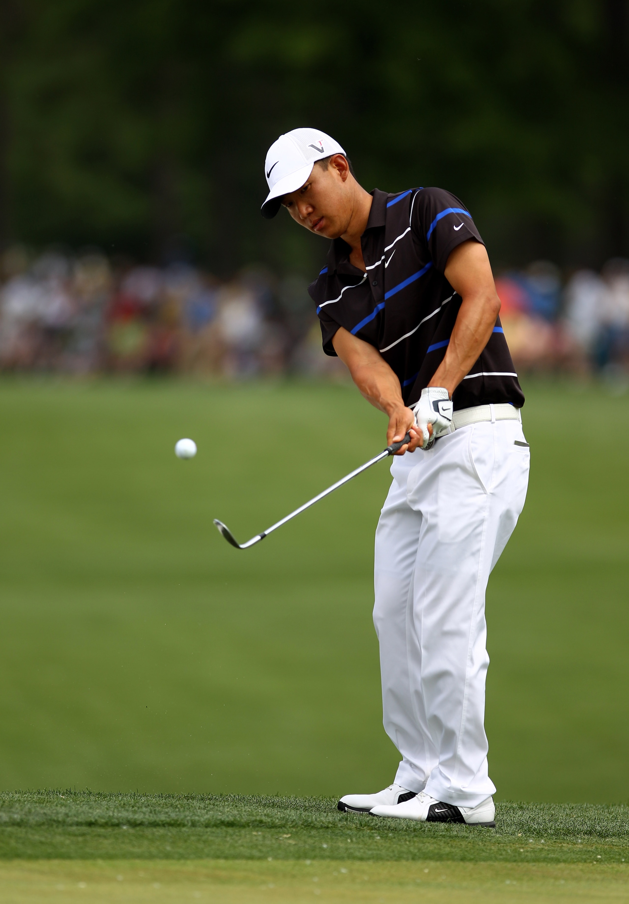 CHARLOTTE, NC - MAY 02:  Anthony Kim chips onto the 1st green during the final round of the Quail Hollow Championship at Quail Hollow Country Club on May 2, 2010 in Charlotte, North Carolina.  (Photo by Richard Heathcote/Getty Images)