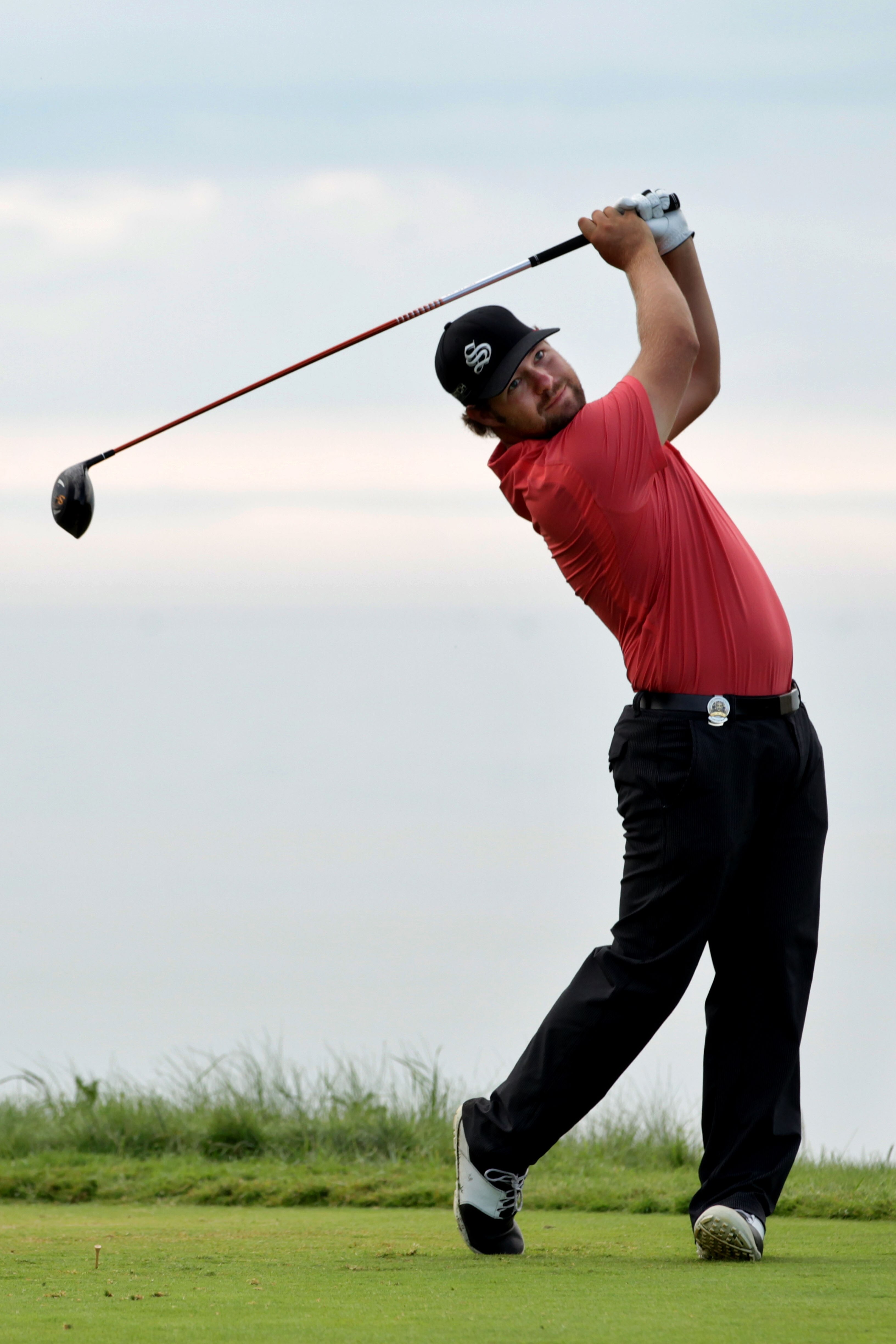 KOHLER, WI - AUGUST 14:  Ryan Moore hits his tee shot on the ninth hole during the continuation of the second round of the 92nd PGA Championship on the Straits Course at Whistling Straits on August 14, 2010 in Kohler, Wisconsin.  (Photo by Andrew Redingto