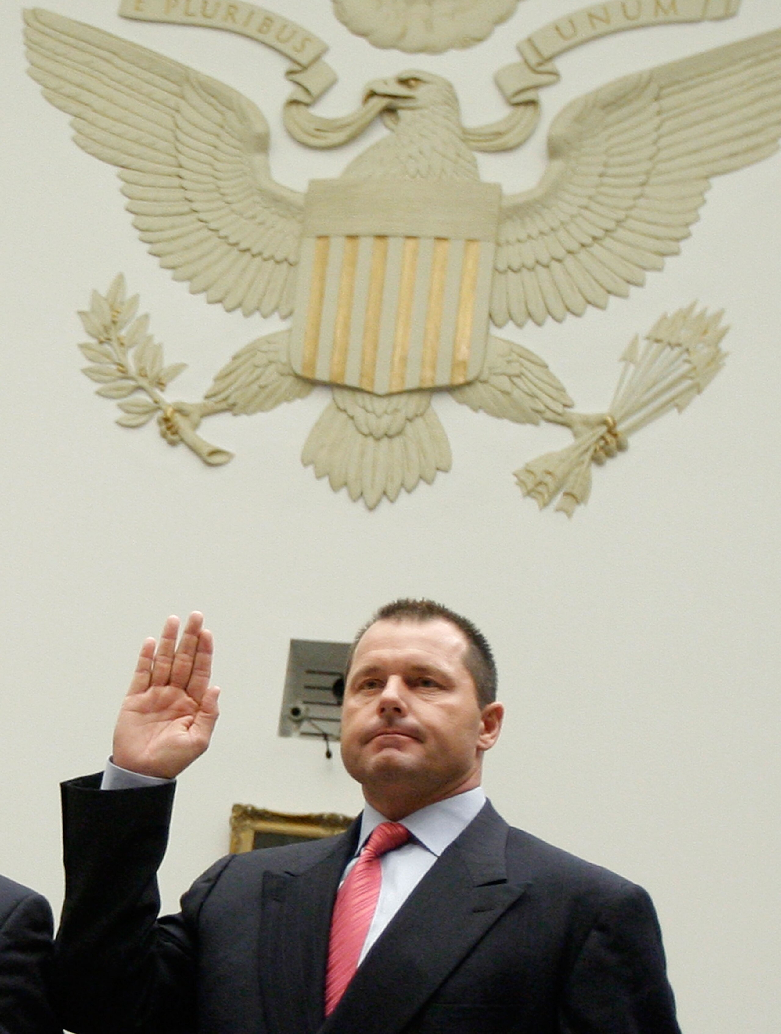 WASHINGTON - FEBRUARY 13: Major League Baseball player Roger Clemens raises his right hand as he is sworn in during a House Oversight and Government Reform Committee, February 13, 2008 in Washington DC. The committee is hearing testimony on the use the i WASHINGTON - FEBRUARY 13: Major League Baseball player Roger Clemens raises his right hand as he is sworn in during a House Oversight and Government Reform Committee, February 13, 2008 in Washington DC. The committee is hearing testimony on the use the i
