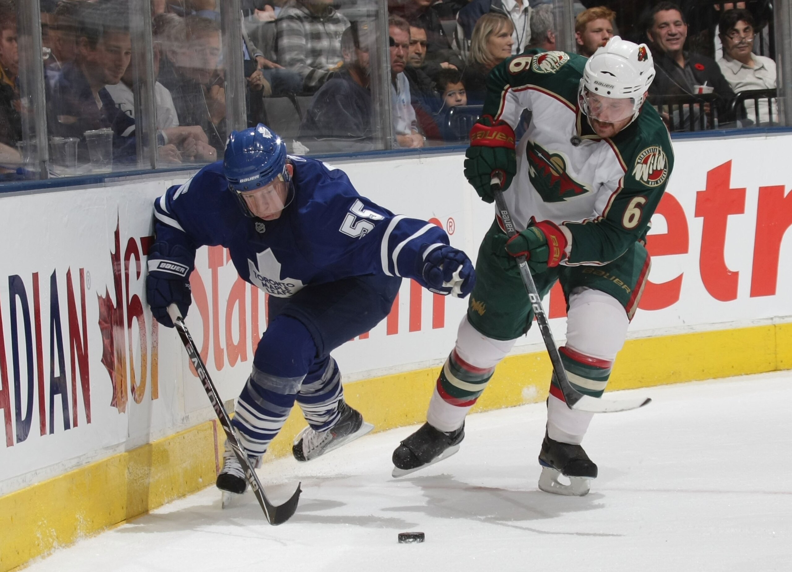 TORONTO, ON - NOVEMBER 10: Greg Zanon #6 of the Minnesota Wild skates against Jason Blake #55 of the Toronto Maple Leafs at the Air Canada Centre on November 10, 2009 in Toronto, Canada.  (Photo by Bruce Bennett/Getty Images)