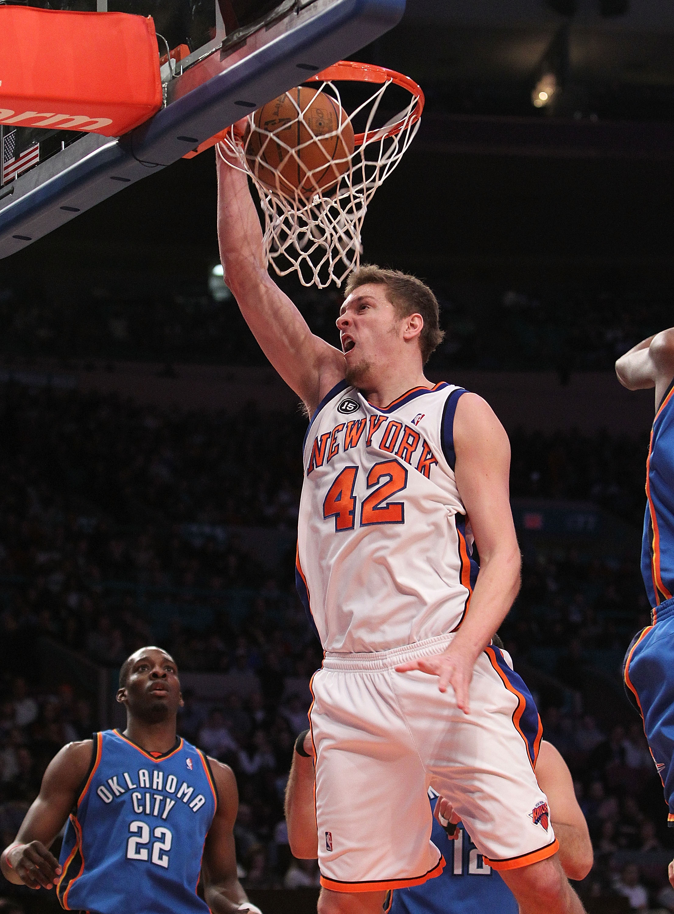 NEW YORK - FEBRUARY 20:  David Lee #42 of the New York Knicks dunks the ball against the Oklahoma City Thunder at Madison Square Garden on February 20, 2010 in New York, New York. NOTE TO USER: User expressly acknowledges and agrees that, by downloading a