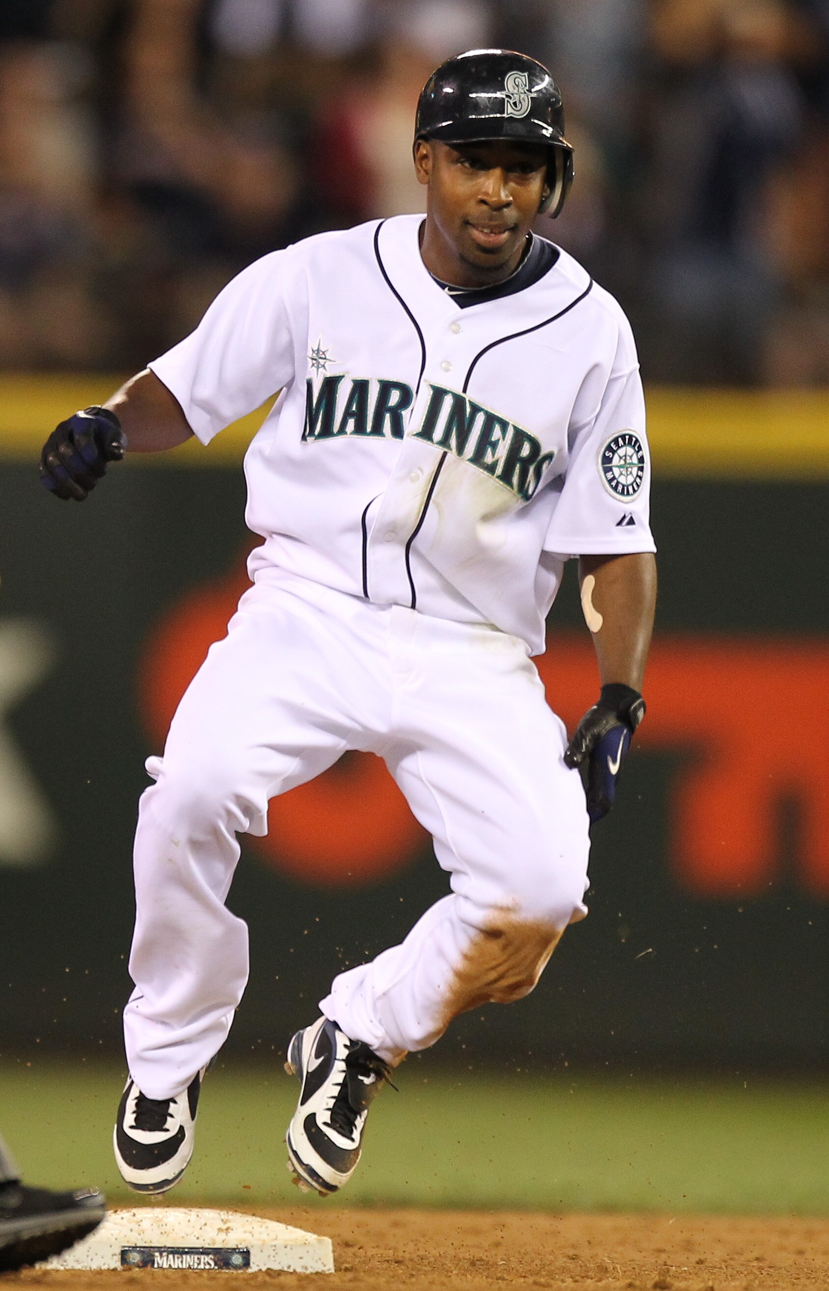 SEATTLE - JULY 24:  Chone Figgins #9 of the Seattle Mariners pulls into second base on an eighth inning double against the Boston Red Sox at Safeco Field on July 24, 2010 in Seattle, Washington. (Photo by Otto Greule Jr/Getty Images)