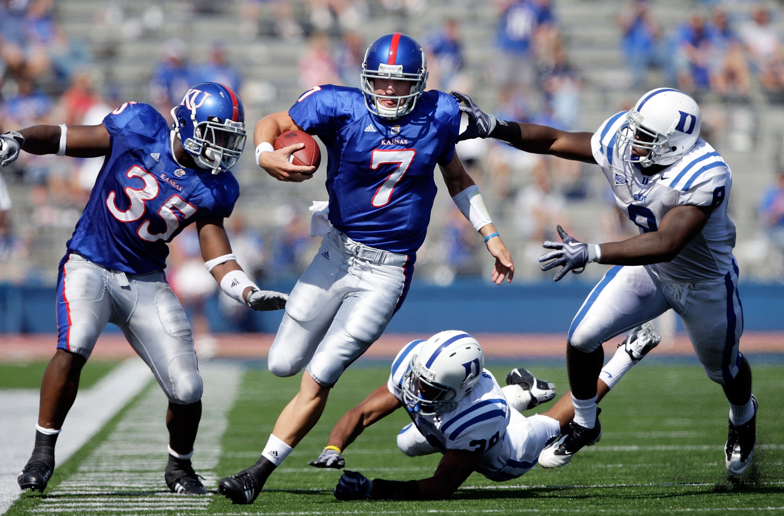 LAWRENCE, KS - SEPTEMBER 19:  Quarterback Kale Pick #7 of the Kansas Jayhawks carries the ball upfield  during the game against the Duke Blue Devils on Kivisto Field at Memorial Stadium on September 19, 2009 in Lawrence, Kansas.  (Photo by Jamie Squire/Ge