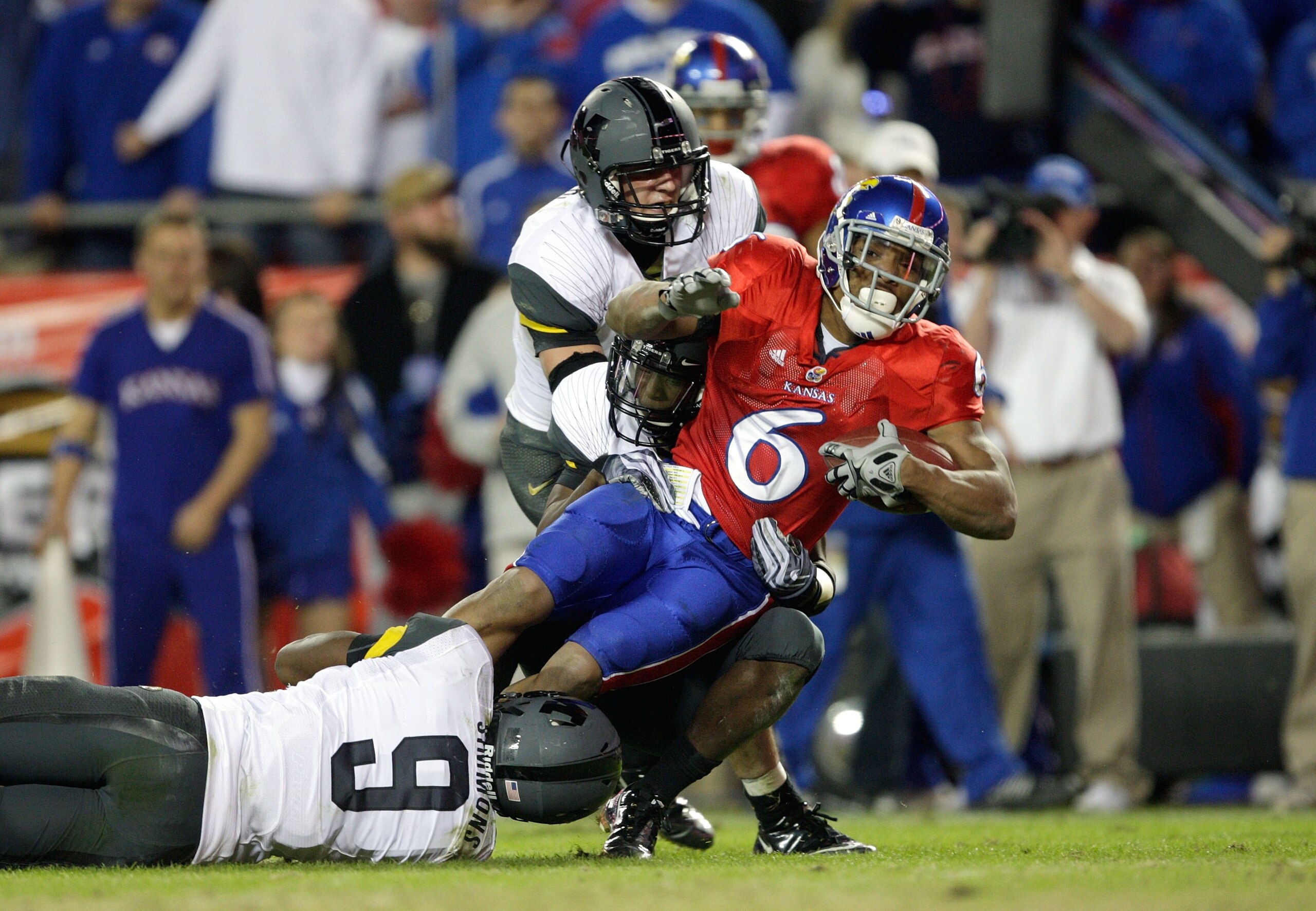 KANSAS CITY, MO - NOVEMBER 28: Running back Rell Lewis #6 of the Kansas Jayhawks is brought down by defenders from the Missouri Tigers at Arrowhead Stadium on November 28, 2009 in Kansas City, Missouri. (Photo by Jamie Squire/Getty Images)