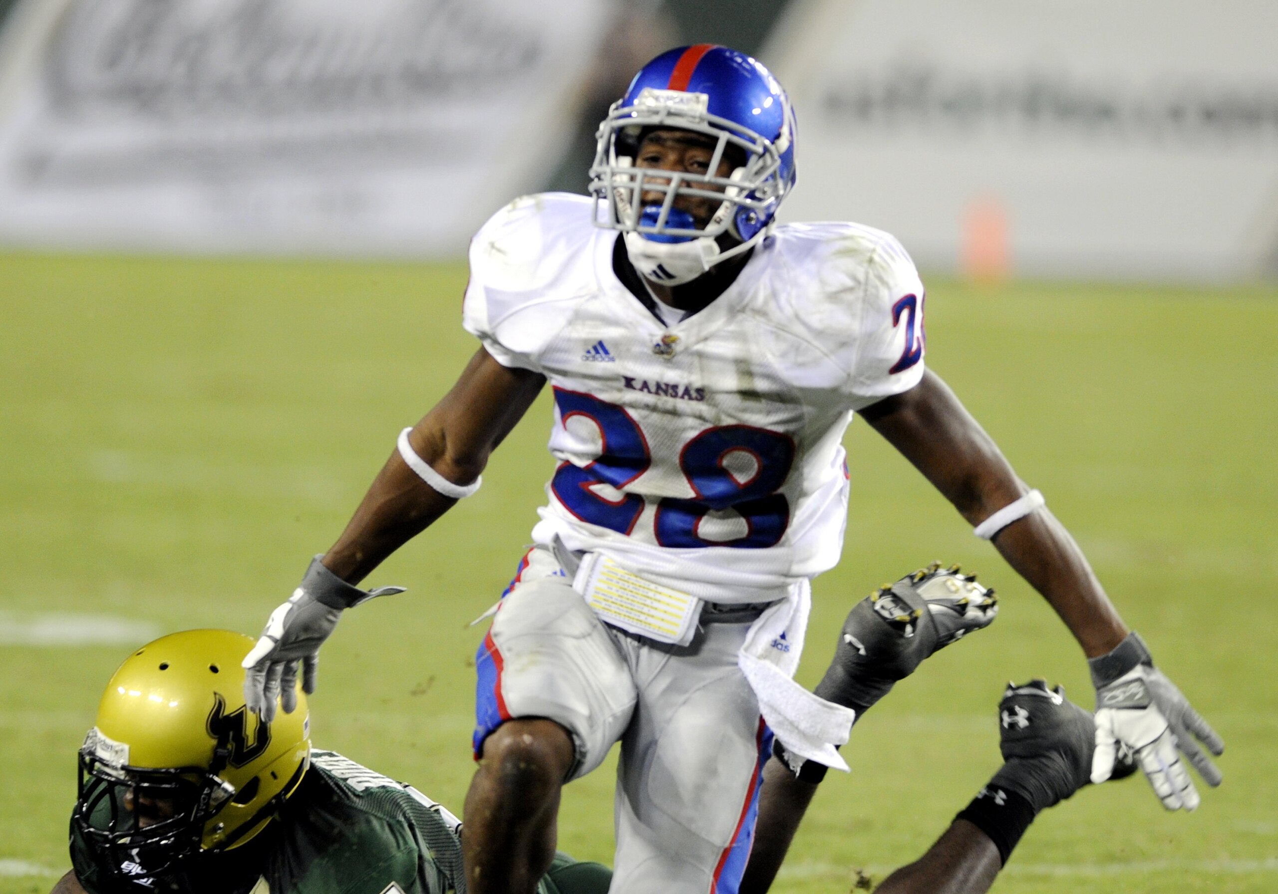 TAMPA, FL - SEPTEMBER 12: Wide receiver Daymond Patterson #28 of the Kansas University Jayhawks dives or a pass against the University of South Florida Bulls at Raymond James Stadium on September 12, 2008 in Tampa, Florida.  (Photo by Al Messerschmidt/Get