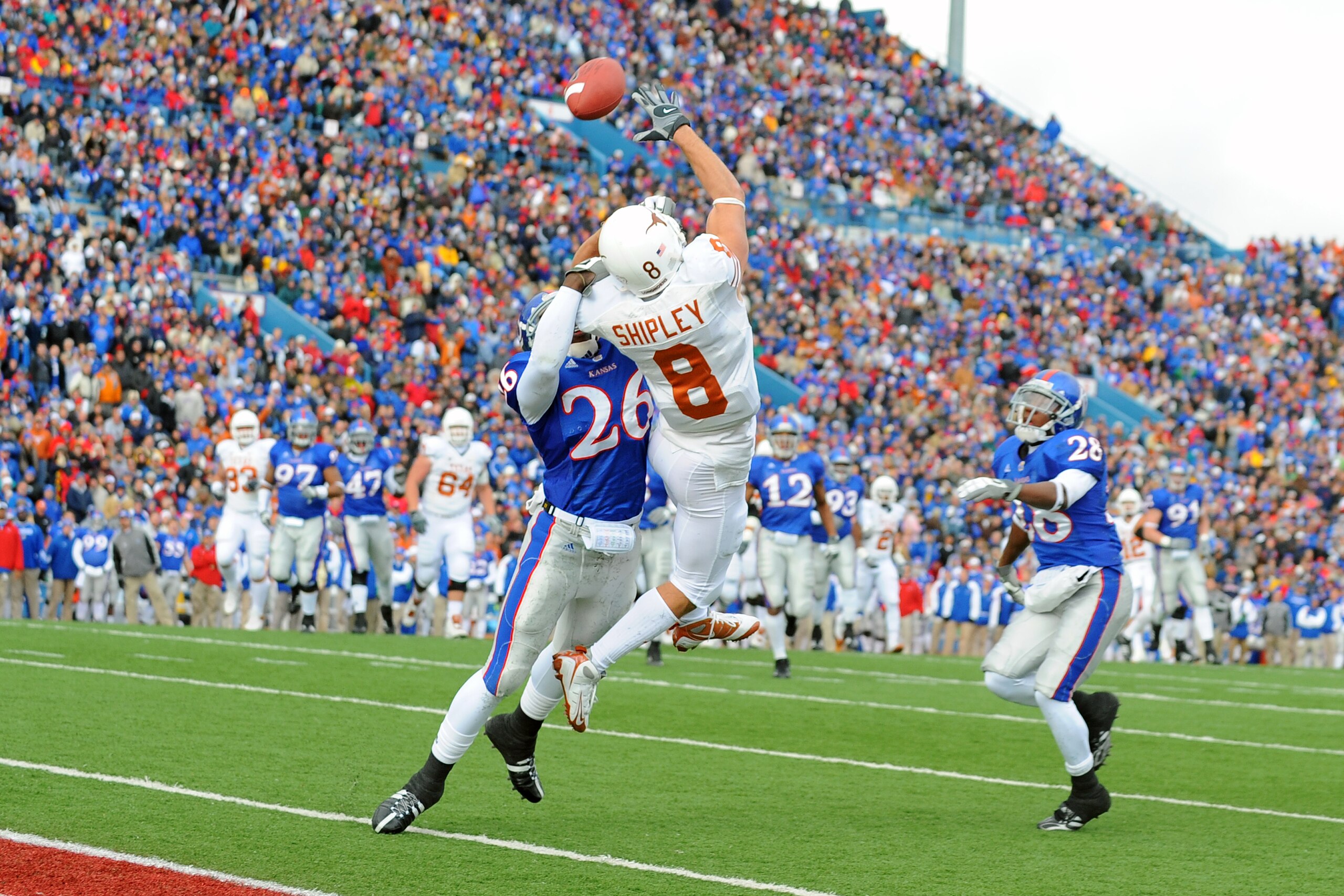 LAWRENCE, KS - NOVEMBER 15:  Jordan Shipley #8 of the Texas Longhorns attempts to make a reception as Phillip Strozier #26 of the Kansas Jayhawks defends on November 15, 2008 at Memorial Stadium in Lawrence, Kansas.  Texas defeated Kansas 35-7. (Photo by