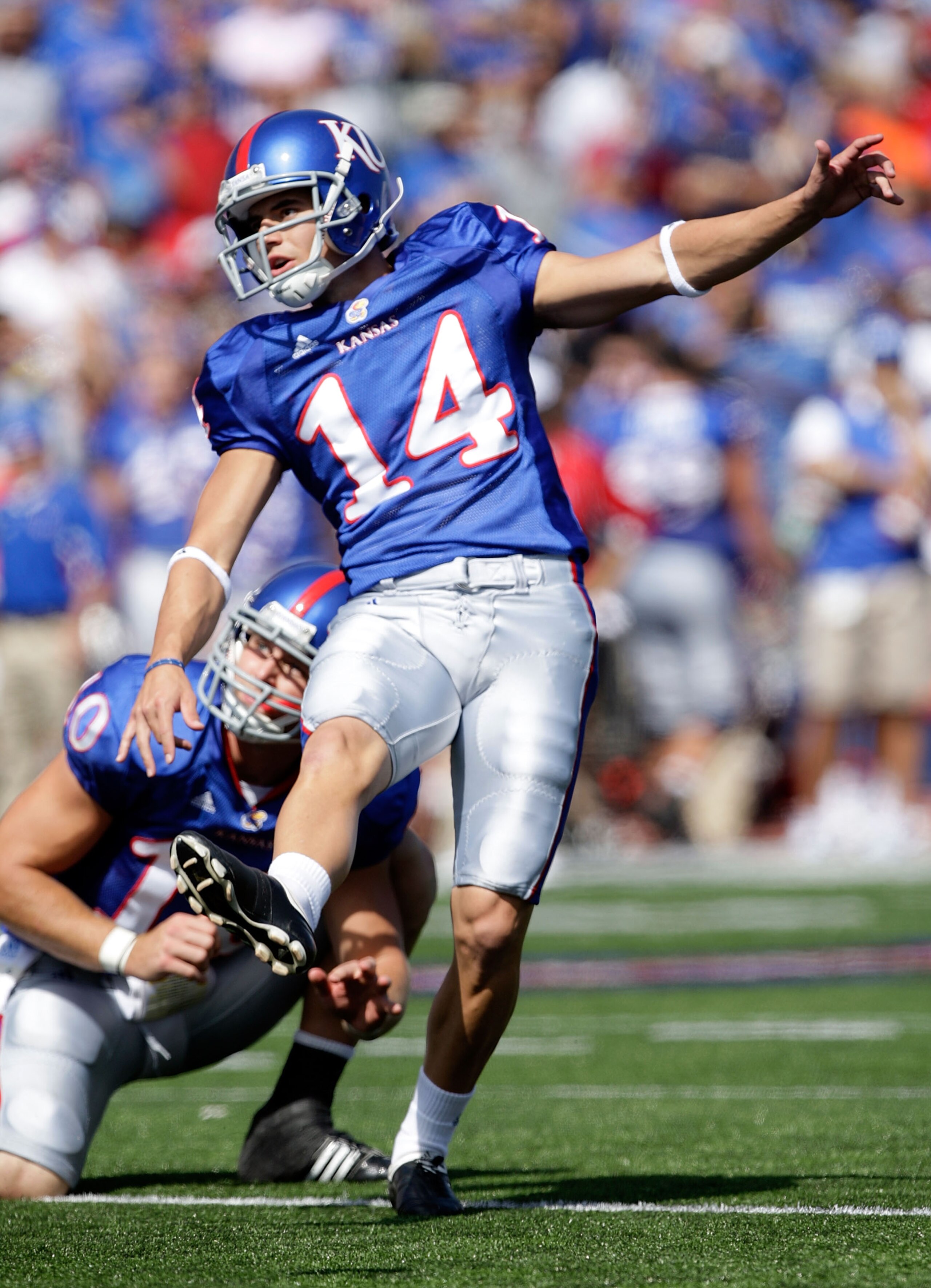 LAWRENCE, KS - SEPTEMBER 19:  Jacob Branstetter #14 of the Kansas Jayhawks kicks an extra point during the game against the Duke Blue Devils on Kivisto Field at Memorial Stadium on September 19, 2009 in Lawrence, Kansas.  (Photo by Jamie Squire/Getty Imag
