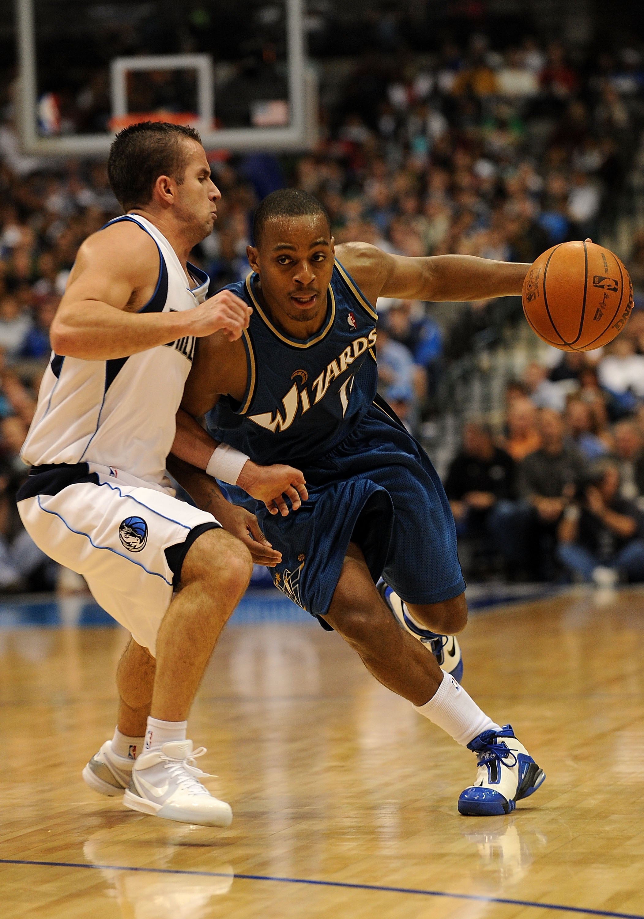 DALLAS - OCTOBER 27:  Guard Randy Foye #15 of the Washington Wizards dribbles the ball past Jose Juan Barea #11 of the Dallas Mavericks on October 27, 2009 at American Airlines Center in Dallas, Texas.  NOTE TO USER: User expressly acknowledges and agrees