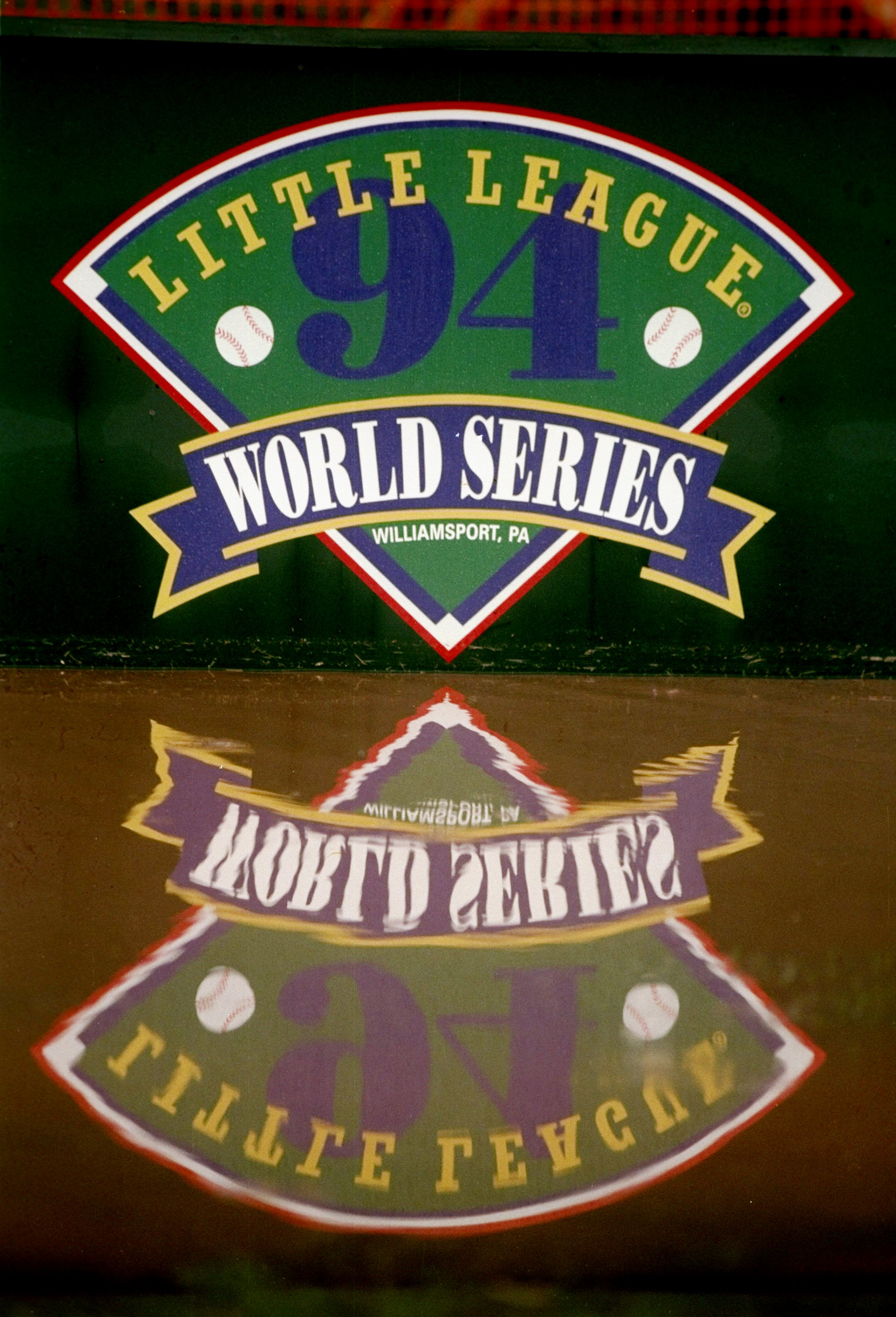 27 Aug 1994:  General view of a World Series banner reflected in a rain puddle during a delay in a Little League World Series game between  Northridge and Venezuela.  Venezuela won the game 4-3. Mandatory Credit: Todd Rosenberg  /Allsport