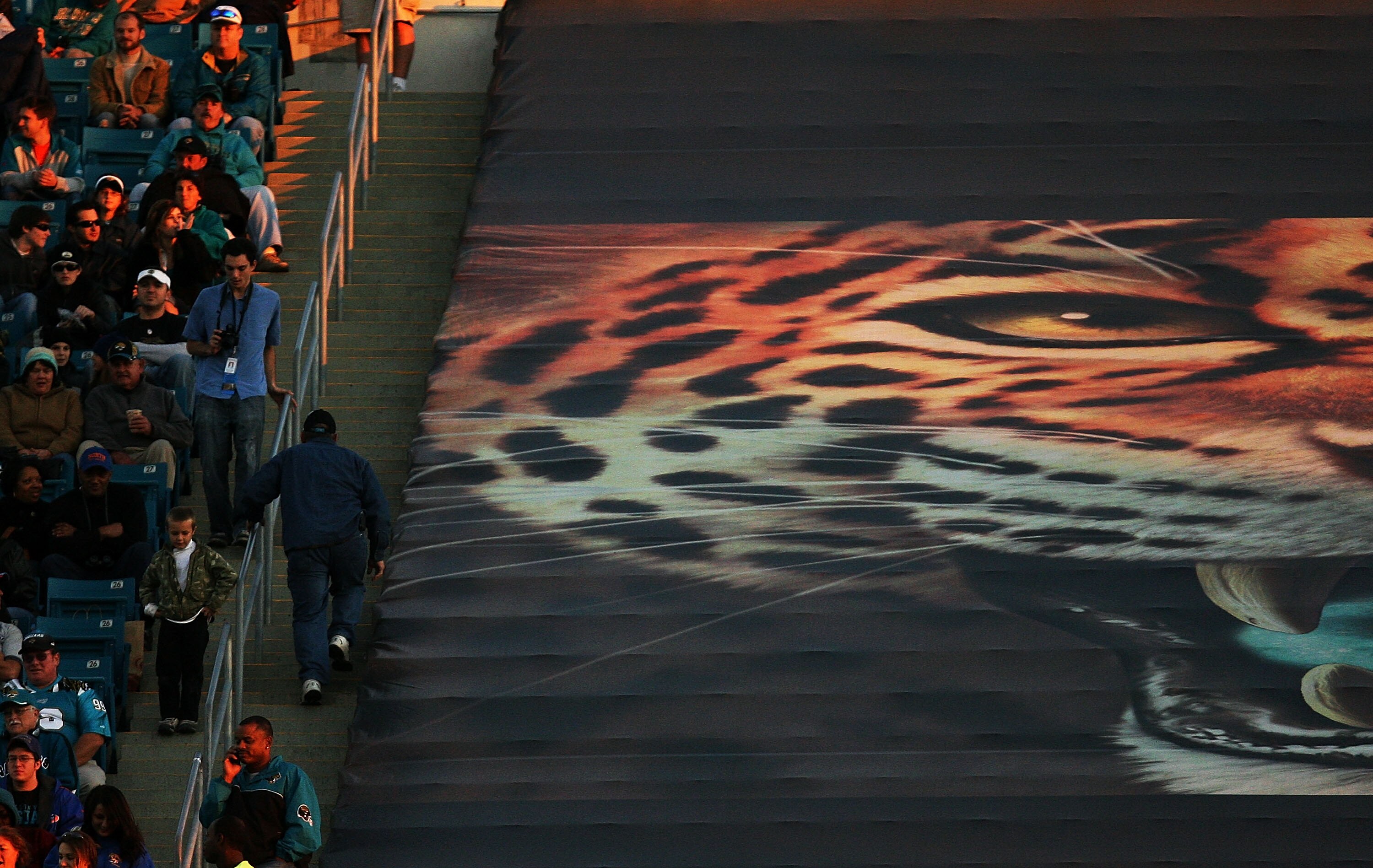 JACKSONVILLE, FL - NOVEMBER 16:  Fans high in the stadium watch as the Jacksonville Jaguars are defeated by the Tennessee Titans at Jacksonville Municipal Stadium on November 16, 2008 in Jacksonville, Florida.   (Photo by Doug Benc/Getty Images)