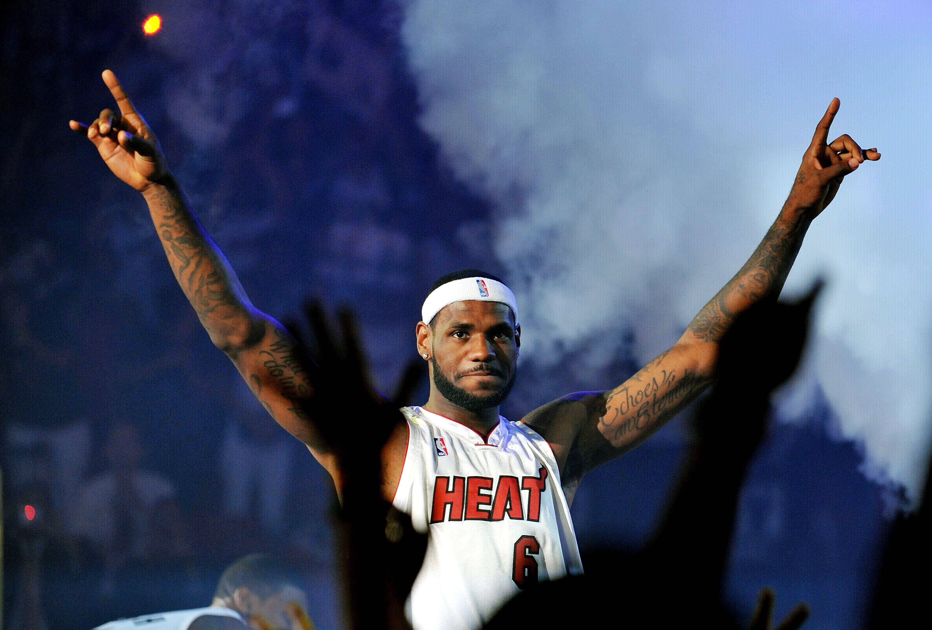 MIAMI - JULY 09:  LeBron James #6 of the Miami Heat greets fans as he is introduced during a welcome party at American Airlines Arena on July 9, 2010 in Miami, Florida.  (Photo by Doug Benc/Getty Images)