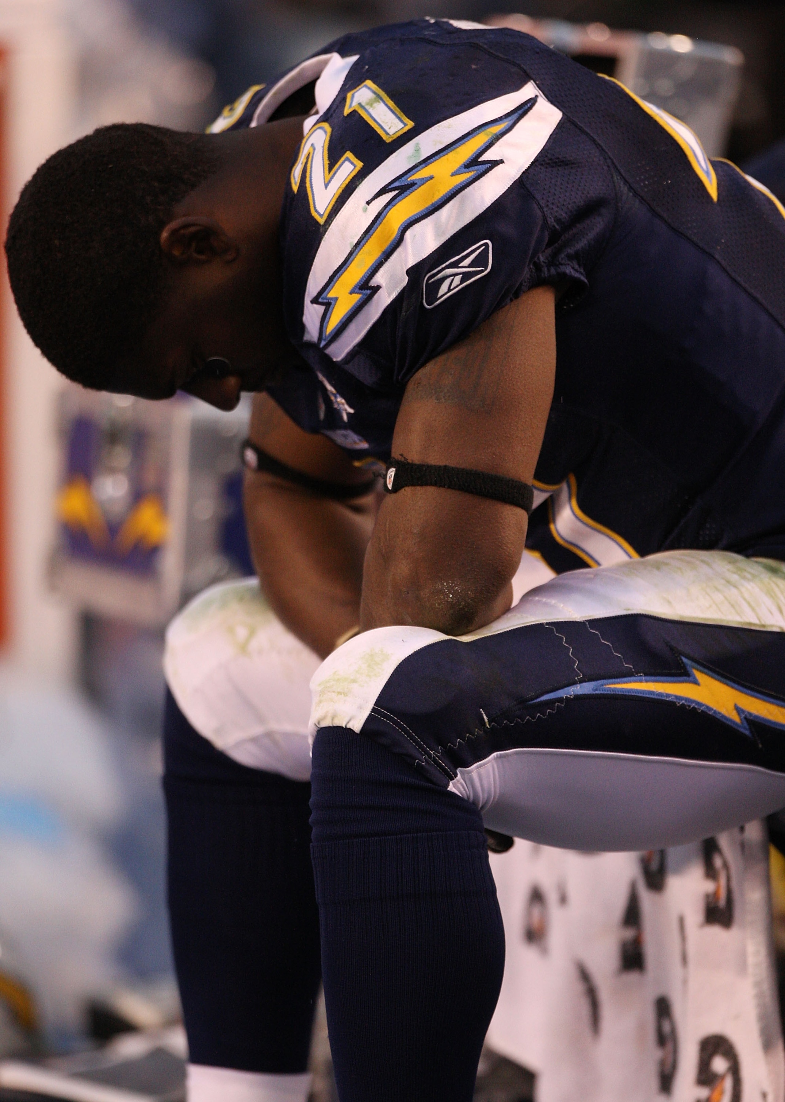 SAN DIEGO - JANUARY 17:  Running back LaDainian Tomlinson #21 of the San Diego Chargers sits on the bench in the final moments of the AFC Divisional Playoff Game against the New York Jets at Qualcomm Stadium on January 17, 2010 in San Diego, California. T