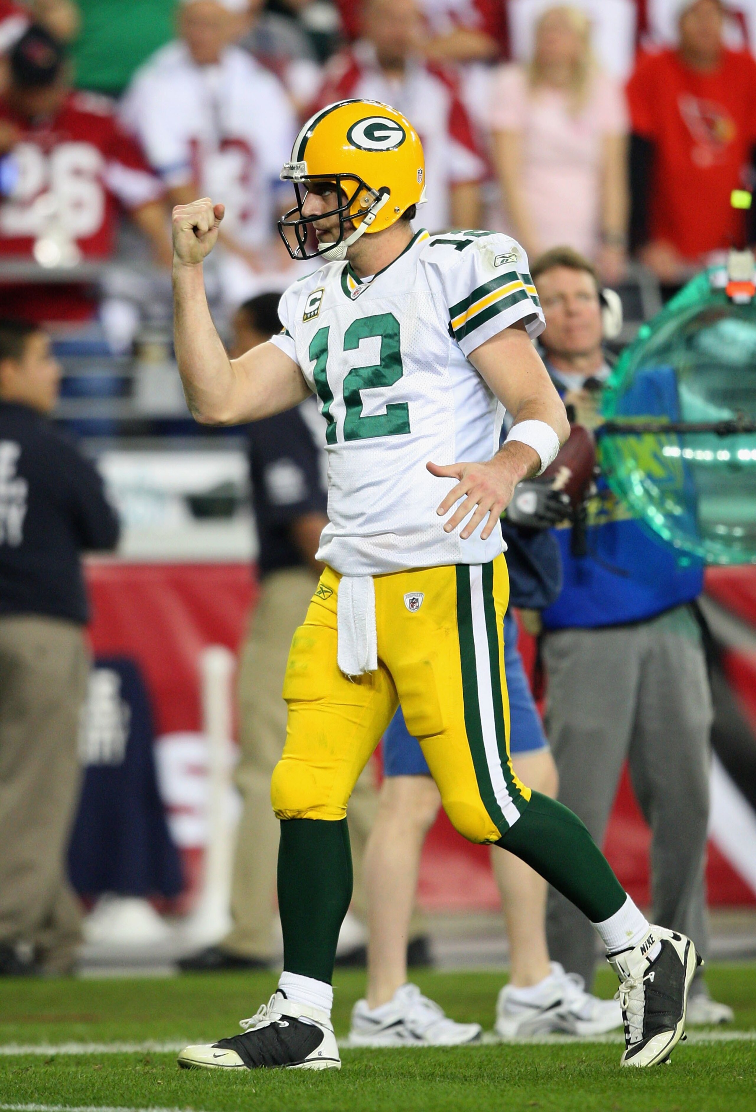 GLENDALE, AZ - JANUARY 10:  Quarterback Aaron Rodgers #12 of the Green Bay Packers celebrates a touchdown during the 2010 NFC wild-card playoff game against the Arizona Cardinals at the Universtity of Phoenix Stadium on January 10, 2010 in Glendale, Arizo