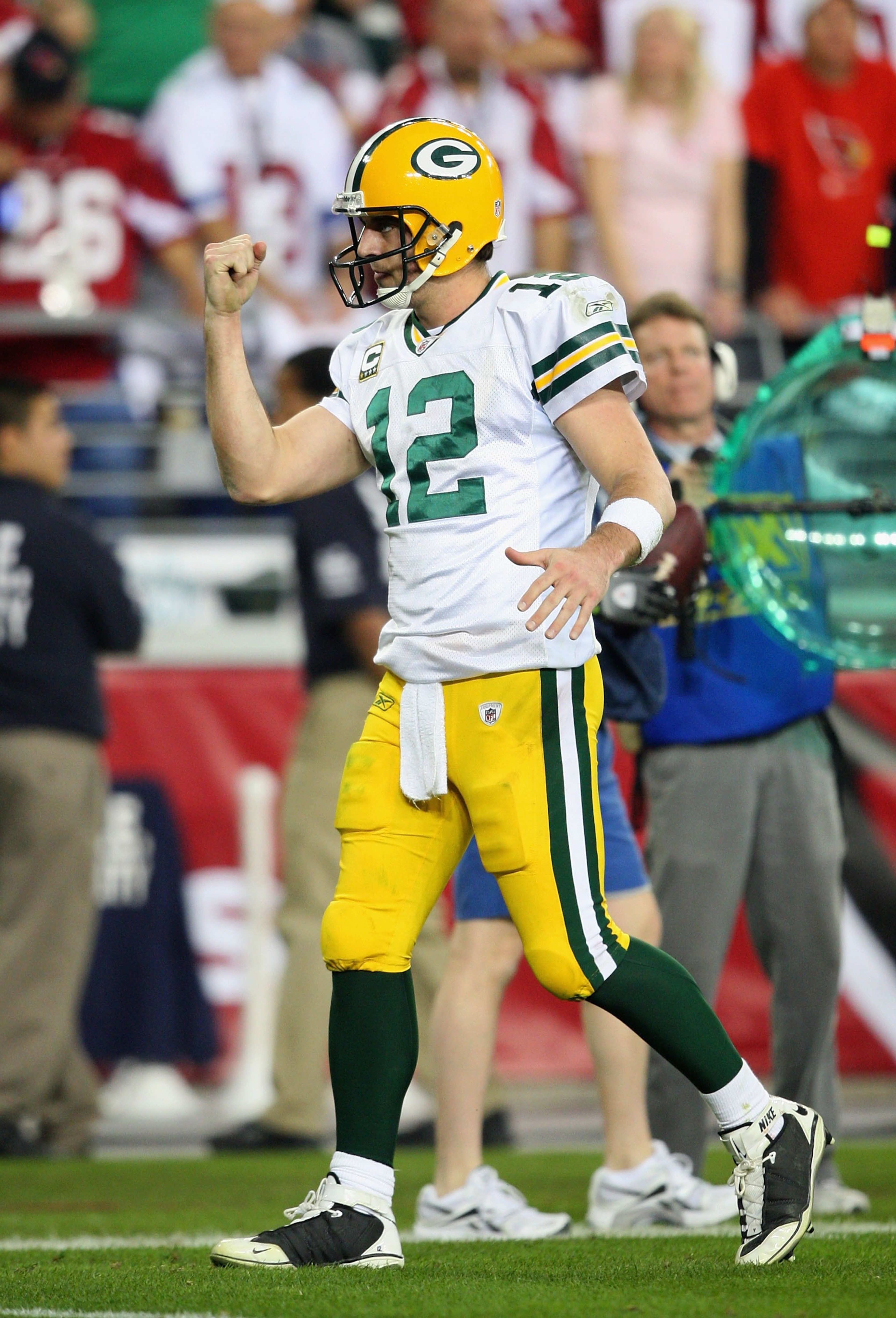 GLENDALE, AZ - JANUARY 10:  Quarterback Aaron Rodgers #12 of the Green Bay Packers celebrates a touchdown during the 2010 NFC wild-card playoff game against the Arizona Cardinals at the Universtity of Phoenix Stadium on January 10, 2010 in Glendale, Arizo