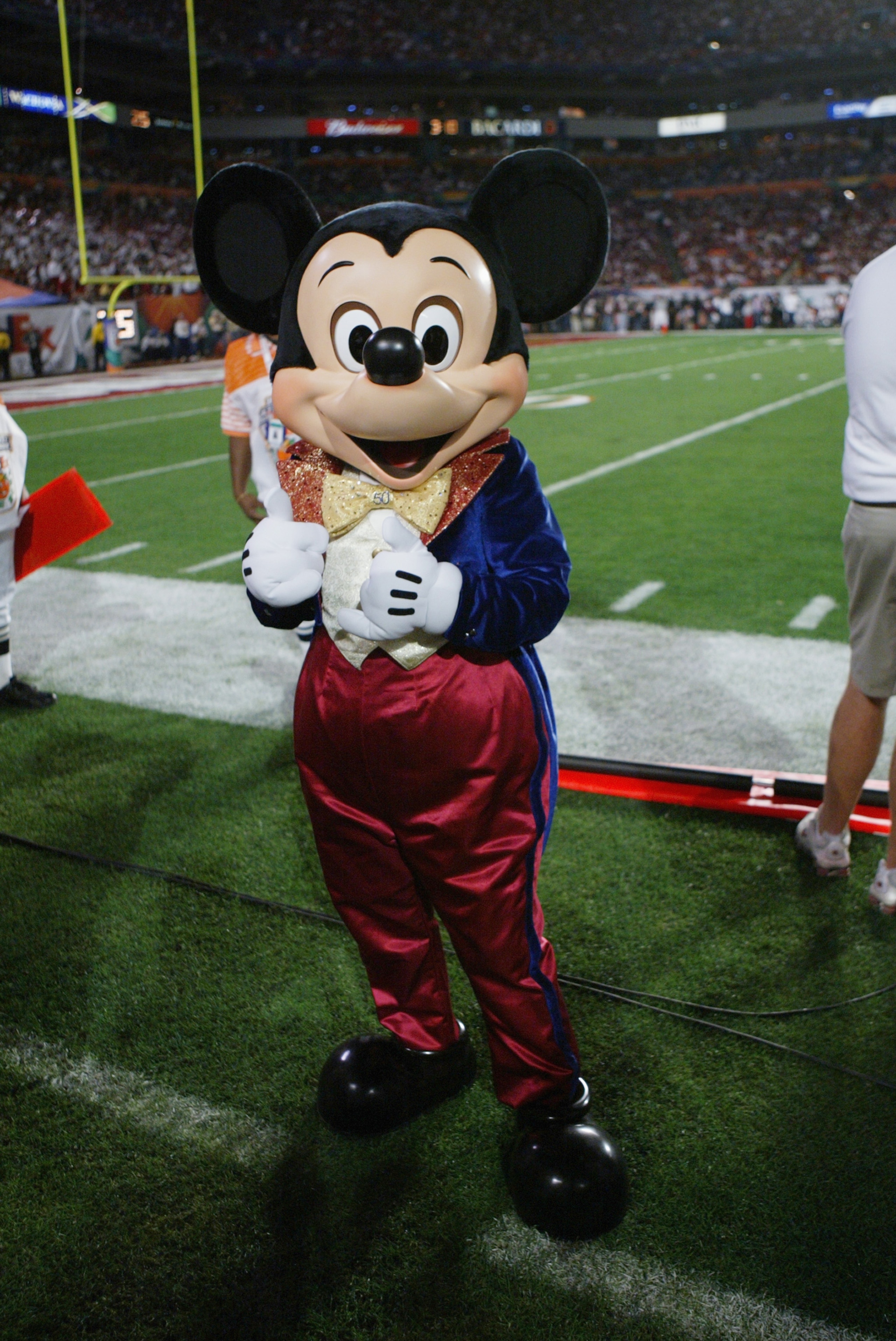 MIAMI - JANUARY 4:  Mickey Mouse is on the sidelines as the USC Trojans face the Oklahoma Sooners in the 2005 FedEx Orange Bowl National Championship on January 4, 2005 at Pro Player Stadium in Miami, Florida. USC defeated Oklahoma 55-19. (Photo by Doug P
