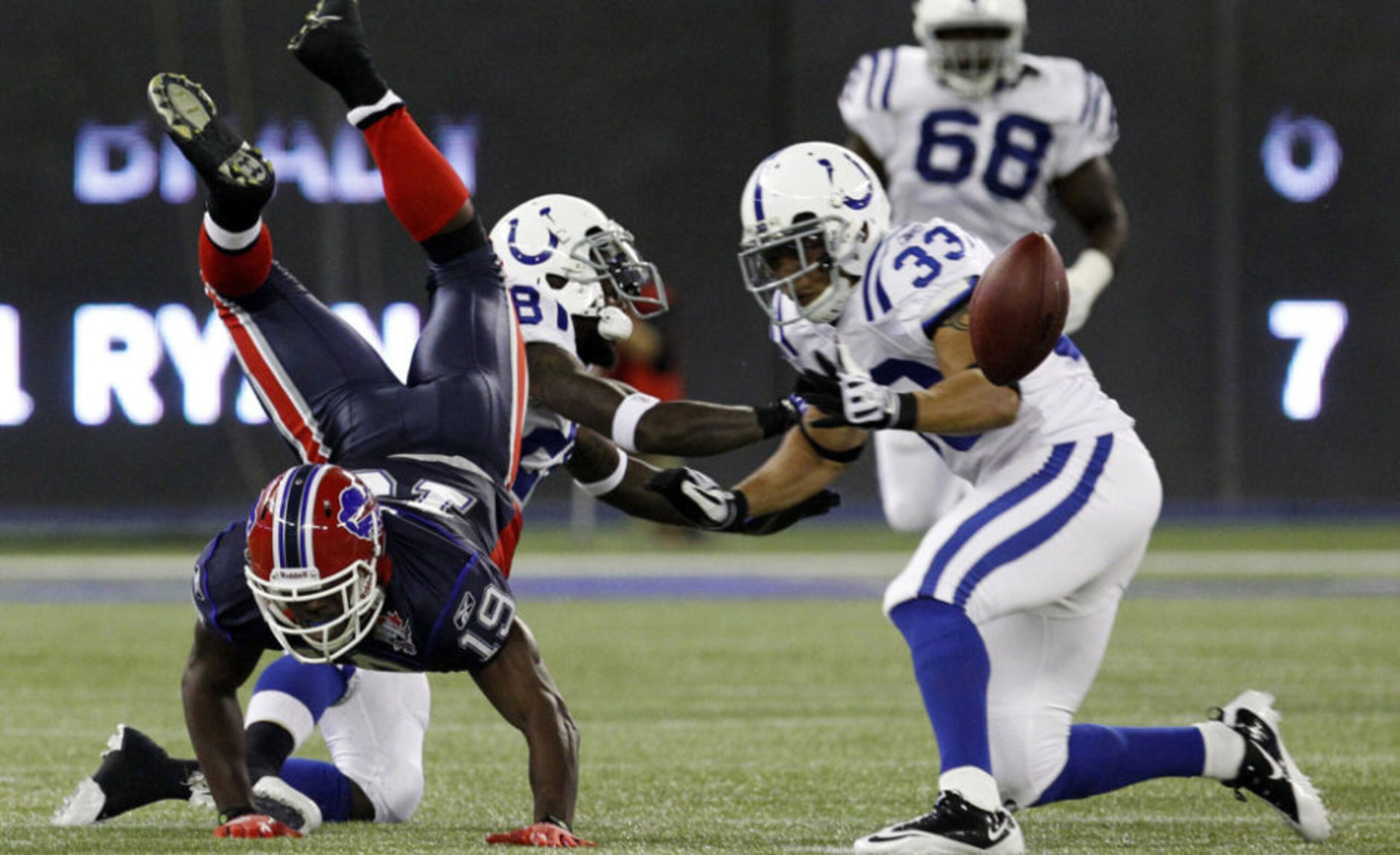 Donald Jones fumbles ball after getting upended. Donald Jones fumbles ball after getting upended.