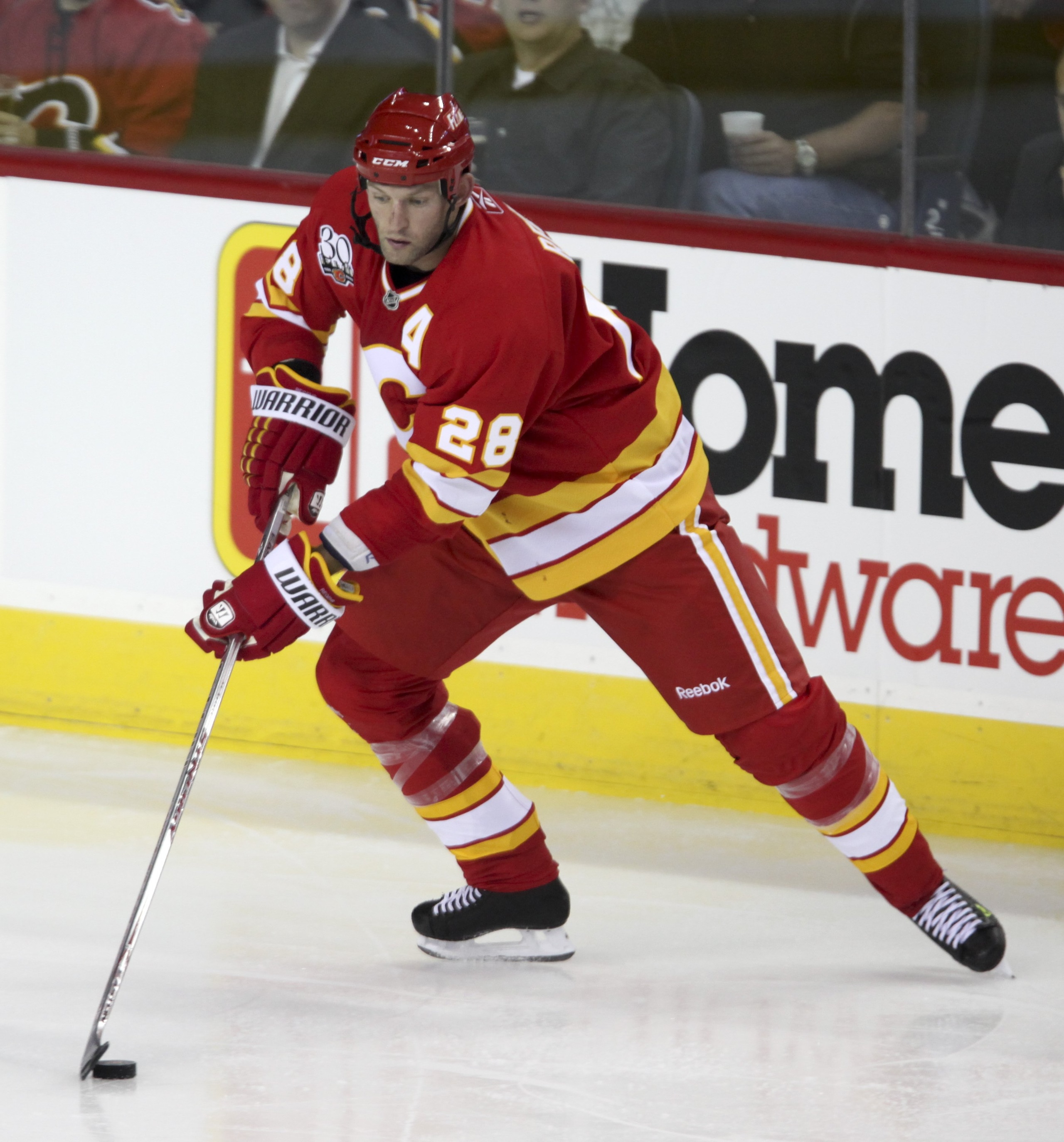 CALGARY, AB - OCTOBER 1: Robyn Regehr #28 of the Calgary Flames in play against the Vancouver Canucks in the third period of NHL action on October 1, 2009 at the Pengrowth Saddledome in Calgary, Alberta. (Photo by Mike Ridewood/Getty Images)