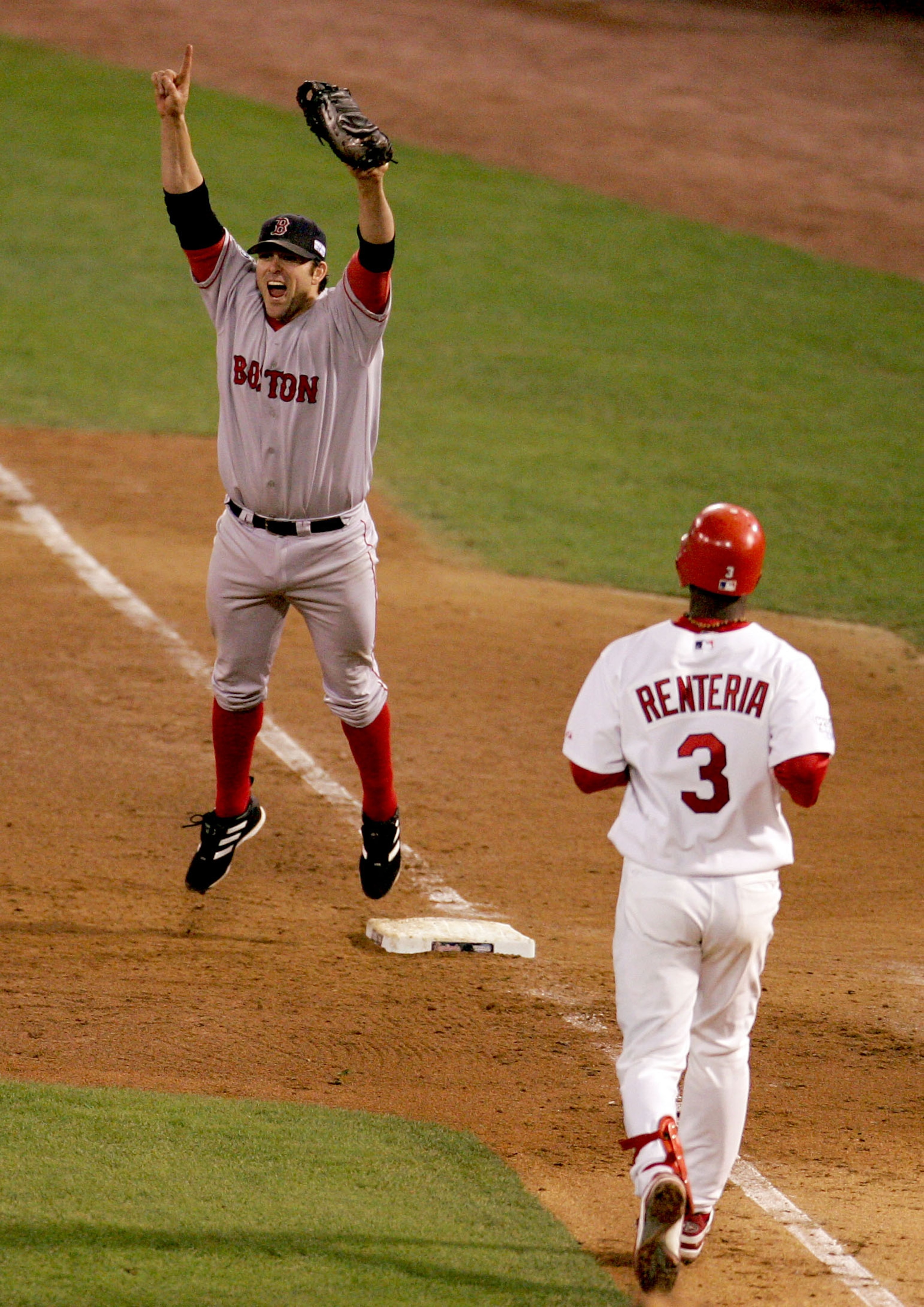 ST LOUIS - OCTOBER 27:  Doug Mientkiewicz #13 of the Boston Red Sox celebrates the final out and defeating the St. Louis Cardinals 3-0 in game four of the World Series on October 27, 2004 at Busch Stadium in St. Louis, Missouri. (Photo by Al Bello/Getty I