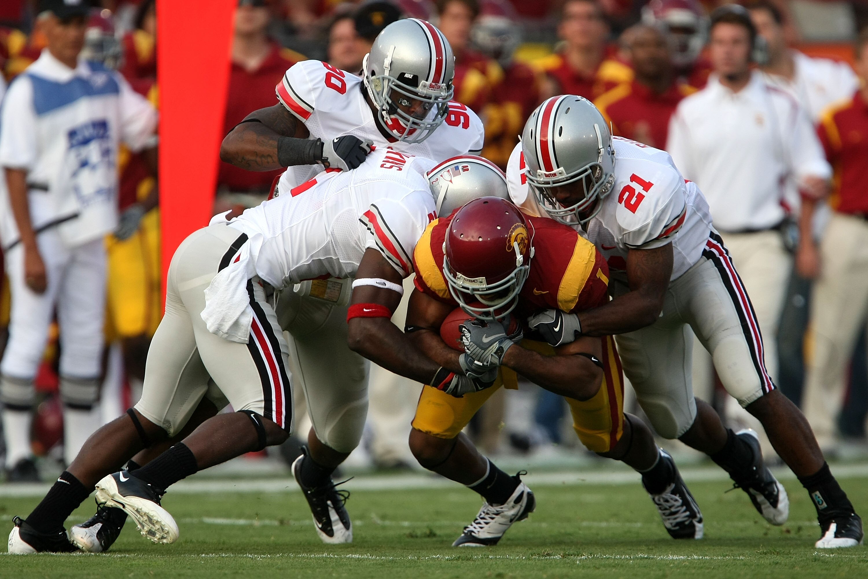 LOS ANGELES, CA - SEPTEMBER 13:  Patrick Turner #1 of the USC Trojans is tackled by three Ohio State Buckeyes defenders during the college football game at the Los Angeles Memorial Coliseum on September 13, 2008 in Los Angeles, California.  (Photo by Step