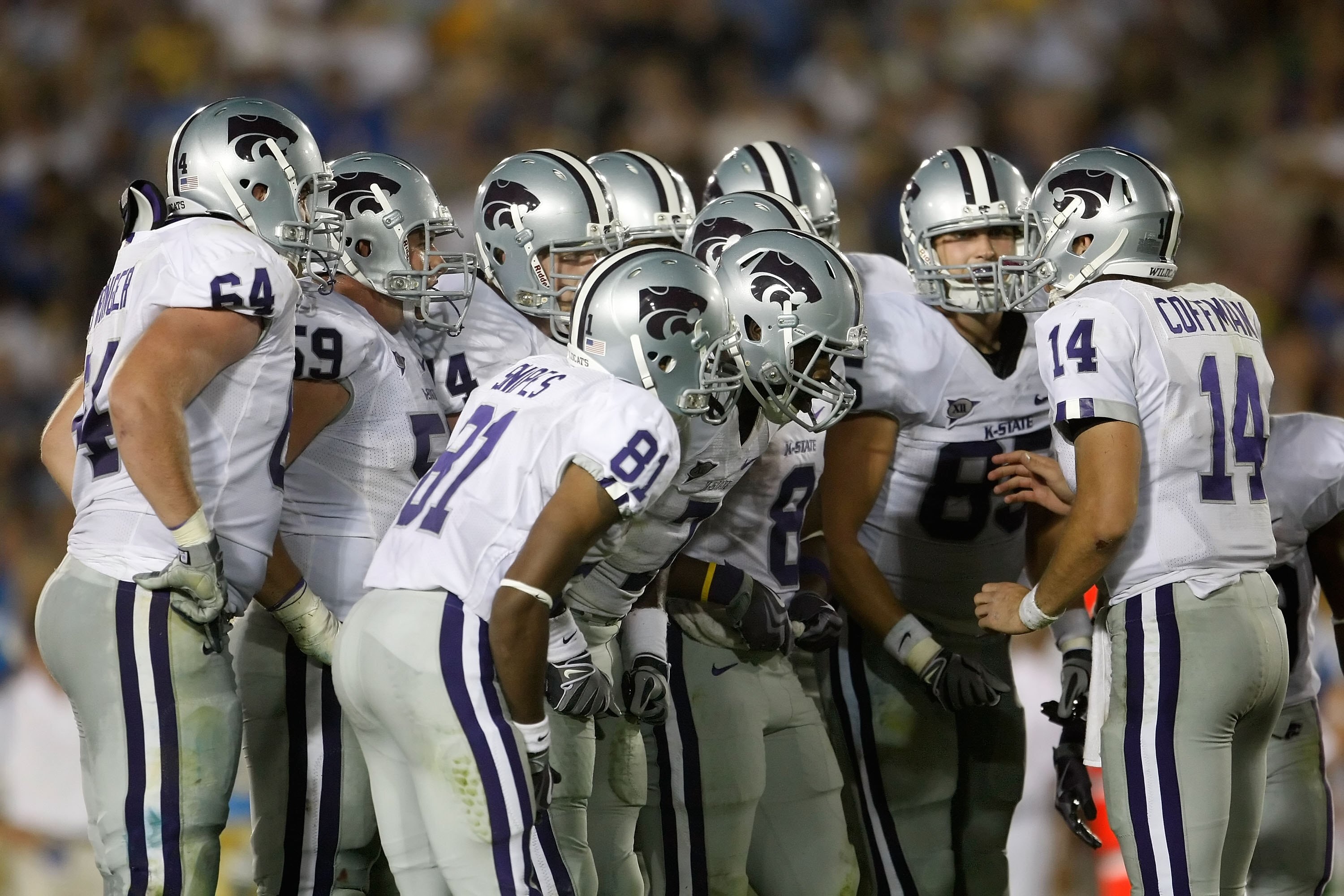 PASADENA, CA - SEPTEMBER 19:  Quarterback Carson Coffman #14 of the Kansas State Wildcats has a huddle with his teammates in the third quater against the UCLA Bruins at the Rose Bowl on September 19, 2009 in Pasadena, California. UCLA defeated Kansas Stat
