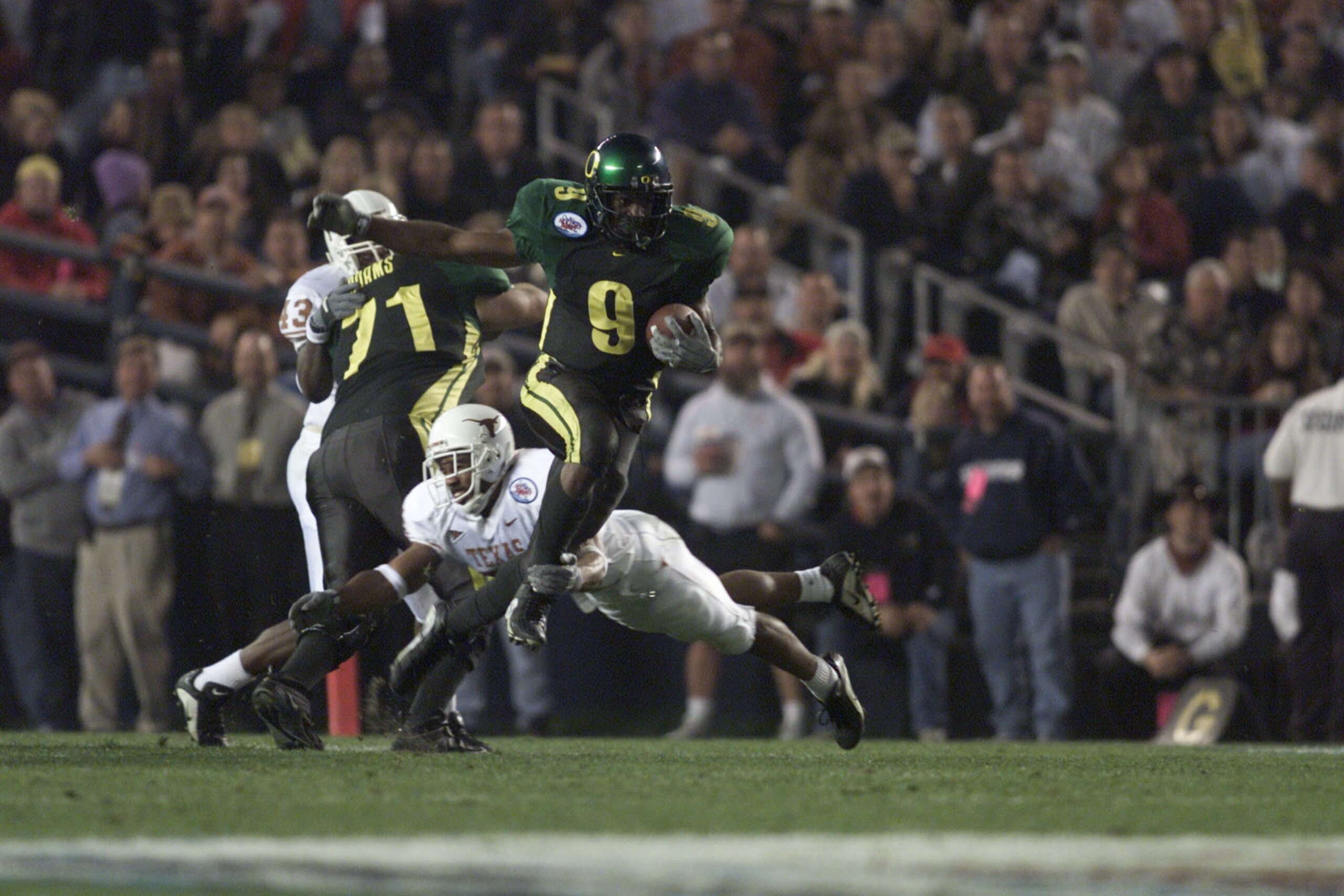 29 Dec 2000:  Maurice Morris #9 of the Oregon Ducks jumps to avoid a tackle by the Texas Longhorns'' defense during the Culligan Holiday Bowl at Qualcomm Stadium in San Diego, California. DIGITAL IMAGE Mandatory Credit: Jeff Gross/ALLSPORT