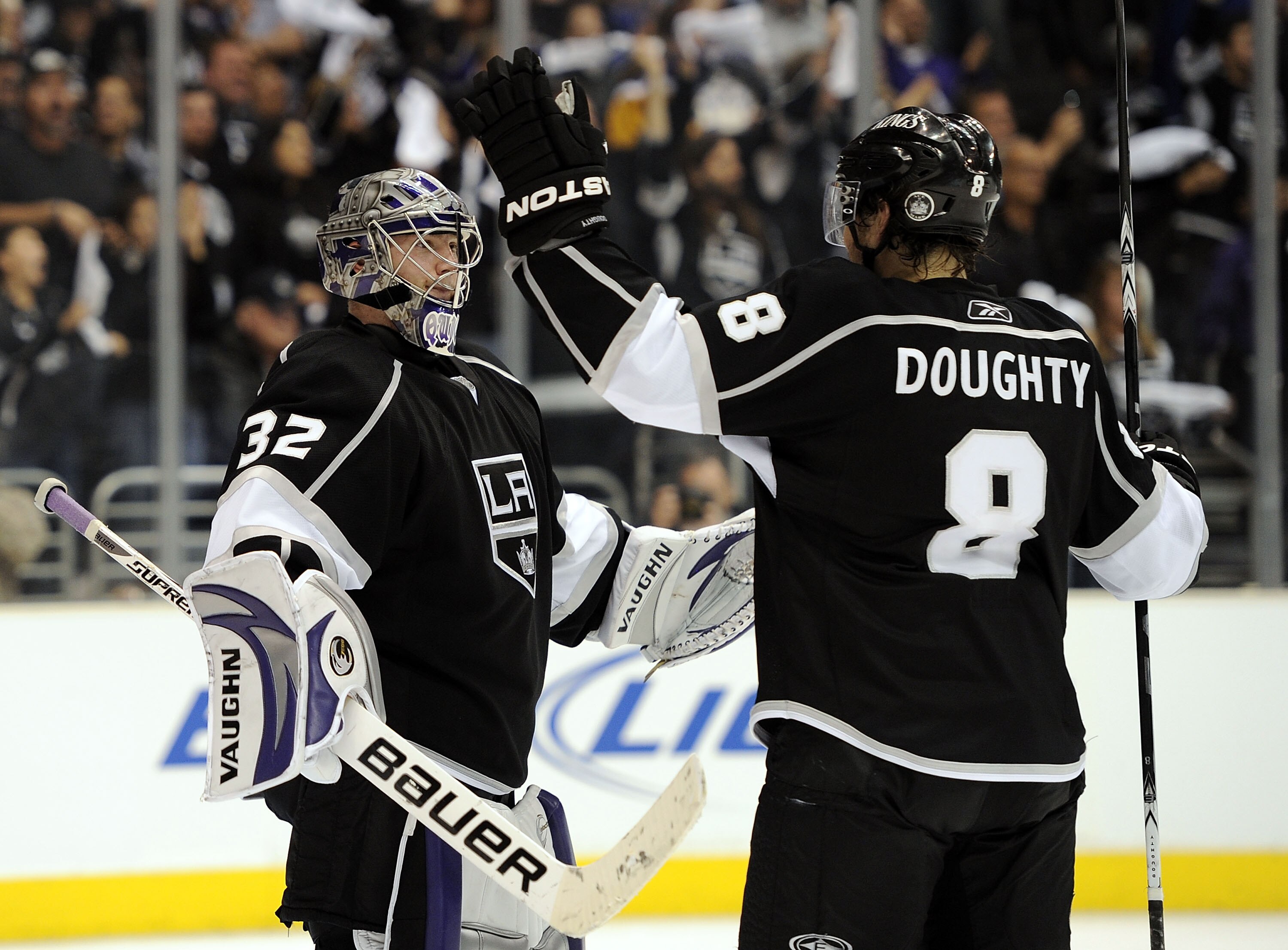 LOS ANGELES, CA - APRIL 19:  Jonathan Quick #32 of the Los Angeles Kings celebrates a 5-3 victory with Drew Doughty #8 over the Vancouver Canucks in game three of the Western Conference Semi-final at Staples Center on April 19, 2010 in Los Angeles, Califo