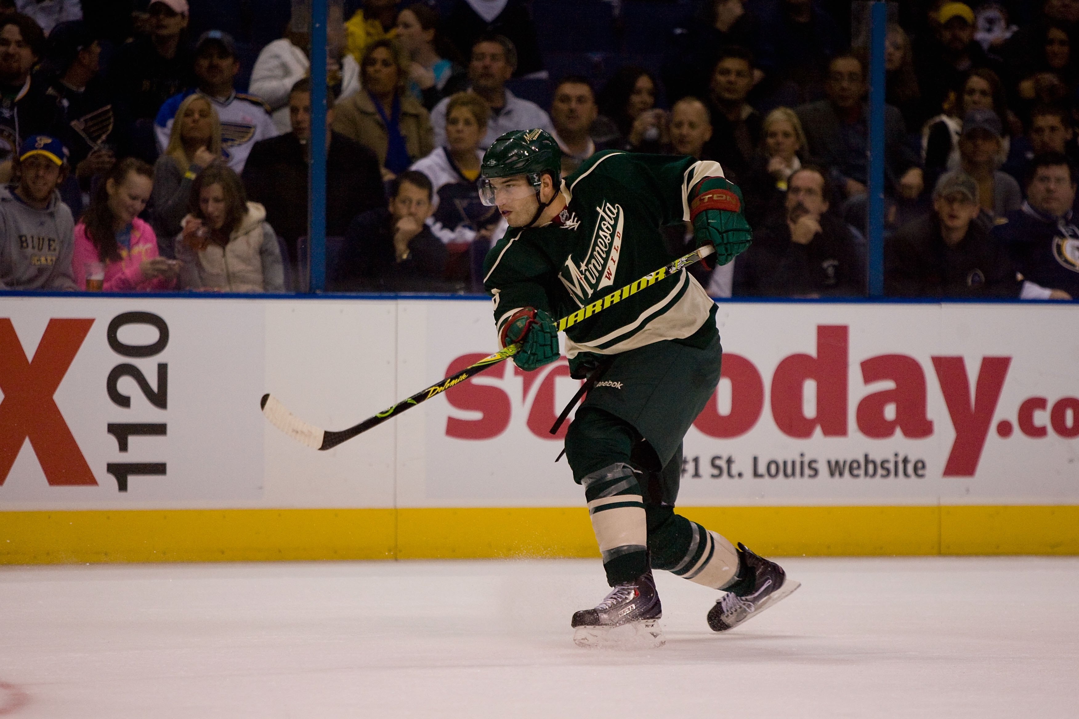 ST. LOUIS - OCTOBER 23: Brent Burns #8 of the Minnesota Wild passes the puck against the St. Louis Blues at the Scottrade Center on October 23, 2009 in St. Louis, Missouri.  (Photo by Dilip Vishwanat/Getty Images)