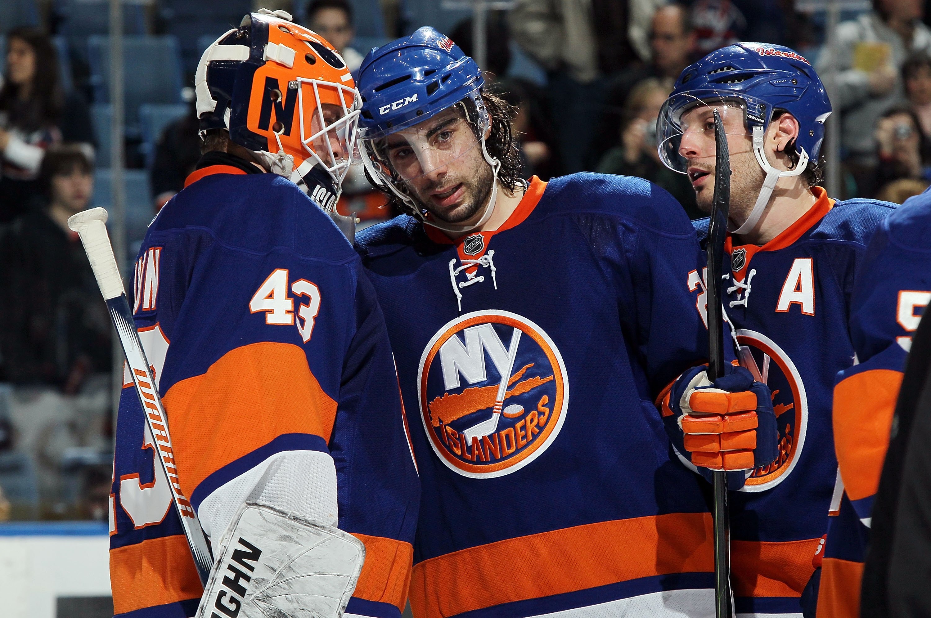 UNIONDALE, NY - MARCH 14:  Martin Biron #43 and Matt Moulson #26 of the New York Islanders celebrate against the Toronto Maple Leafs on March 14, 2010 at Nassau Coliseum in Uniondale, New York. The Isles defeated the Leafs 4-1.  (Photo by Jim McIsaac/Gett