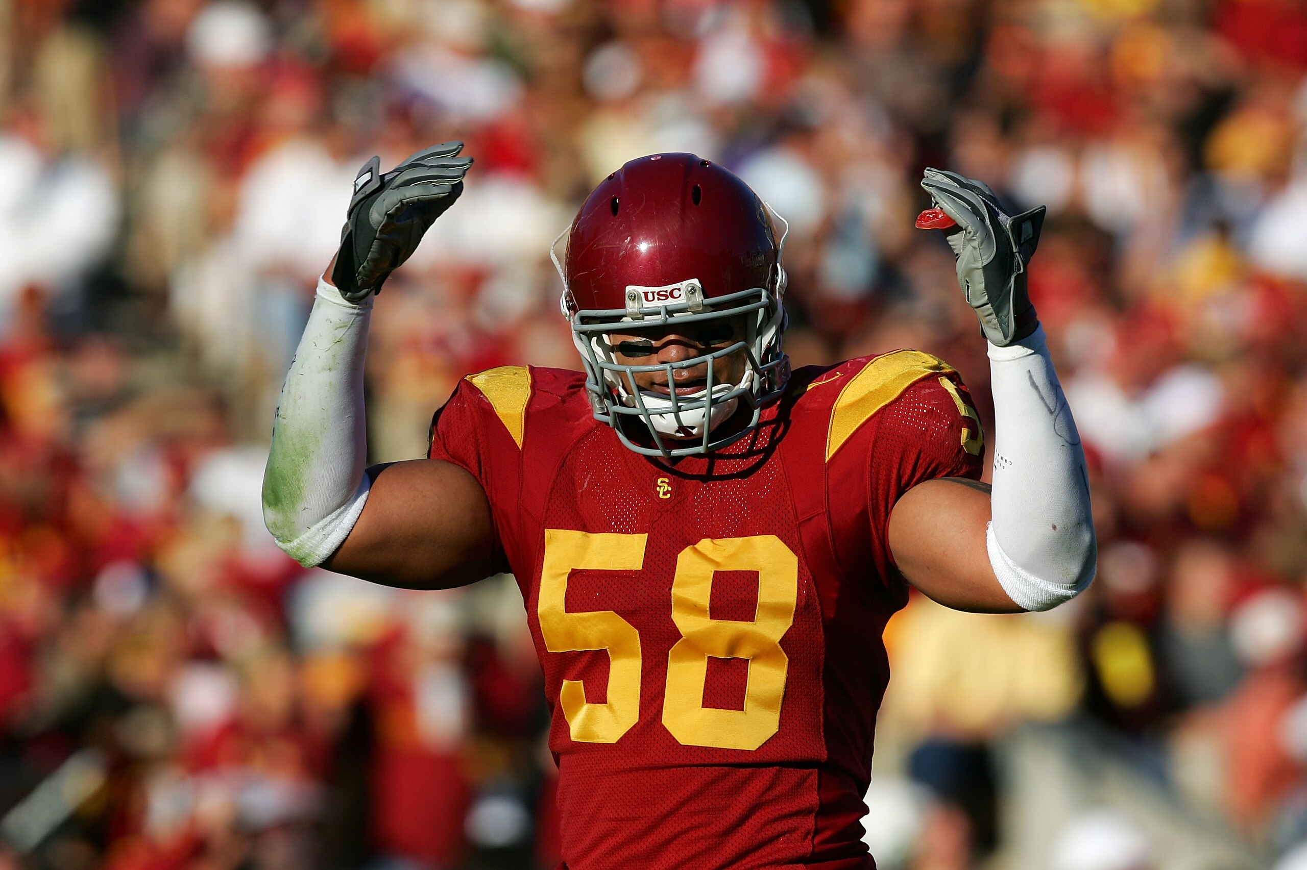 LOS ANGELES, CA - DECEMBER 03:  Rey Maualuga #58 of the USC Trojans gets pumped up against the UCLA Bruins December 3, 2005 at the Los Angeles Memorial Coliseum in Los Angeles, California. USC won 66-19. (Photo by Harry How/Getty Images)