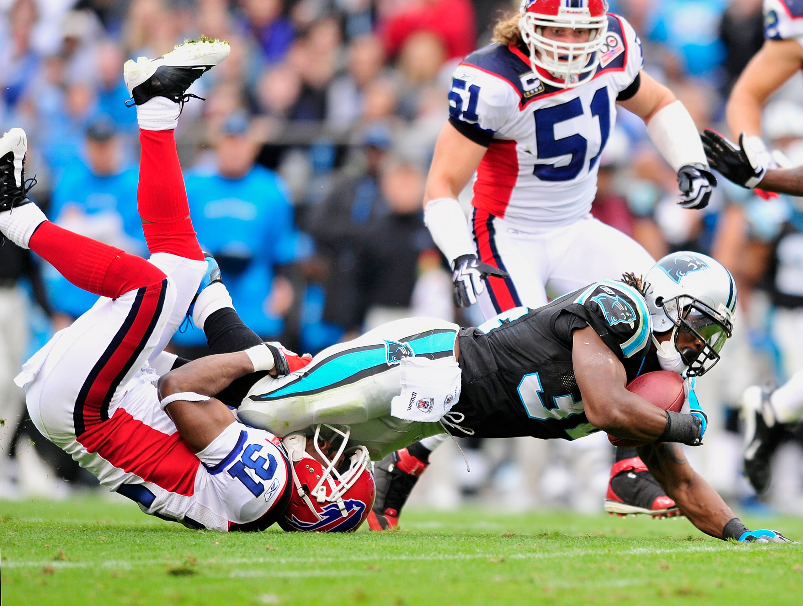 CHARLOTTE, NC - OCTOBER 25:  Jarius Byrd #31 of the Buffalo Bills tackles DeAngelo Williams #34 of the Carolina Panthers  during the first quarter at Bank of America Stadium on October 25, 2009 in Charlotte, North Carolina.  (Photo by Grant Halverson/Gett