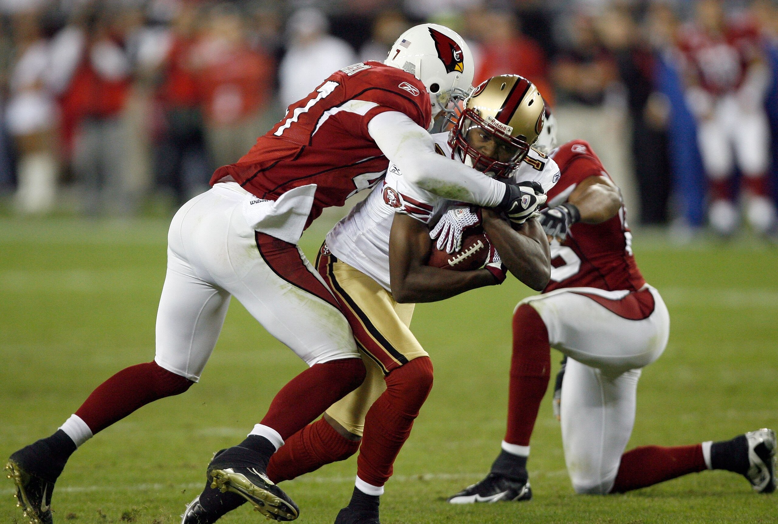 GLENDALE, AZ - NOVEMBER 10:  Dominique Zeigler #17 of the San Francisco 49ers is tackled  by the Arizona Cardinals defense during the game at University of Phoenix Stadium on November, 10 2008 in Glendale, Arizona.  (Photo by Harry How/Getty Images)