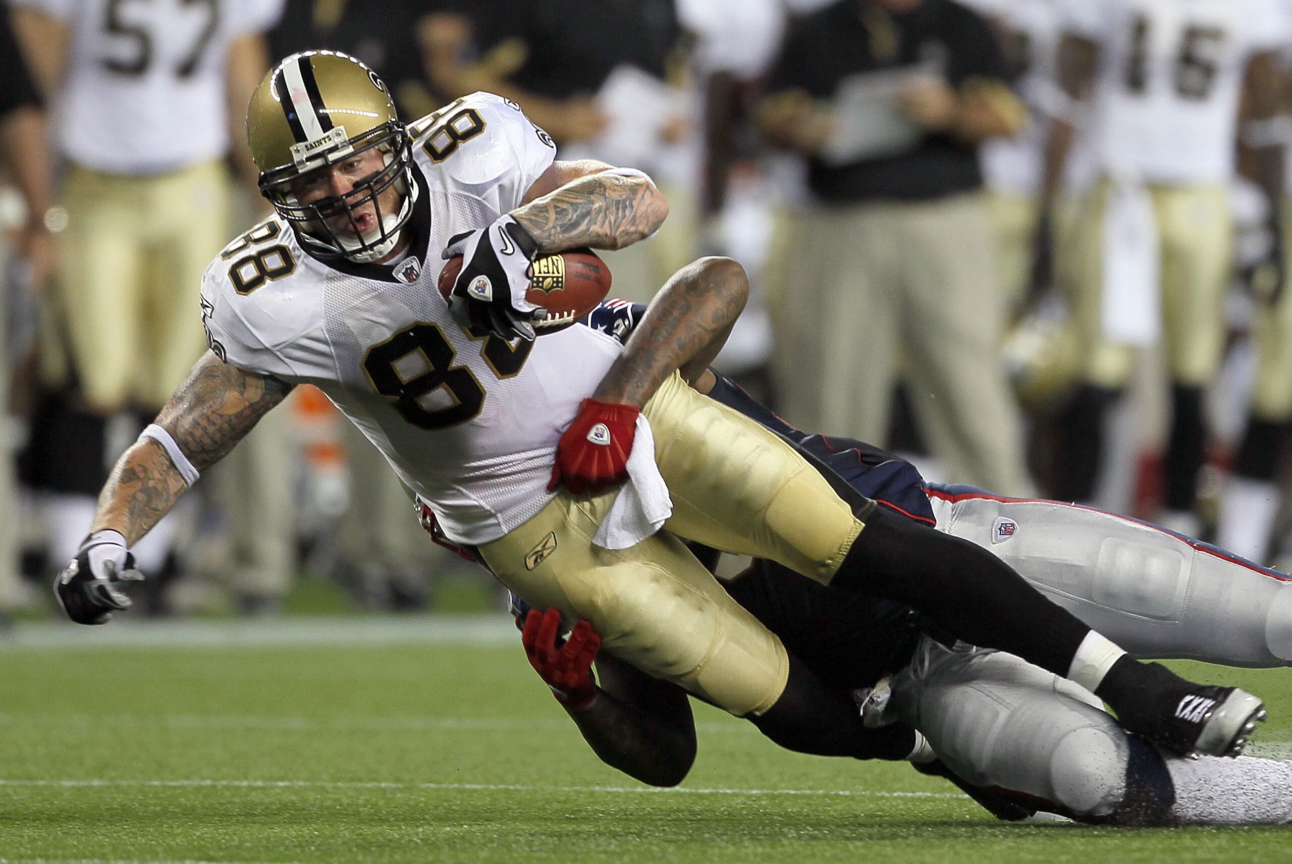 FOXBORO, MA - AUGUST 12: Jeremy Shockey #88 of the New Orleans Saints is tackled by Brandon Spikes # 55 of the New England Patriots during a preseason game at Gillette Stadium on August 12, 2010 in Foxboro, Massachusetts. (Photo by Jim Rogash/Getty Images
