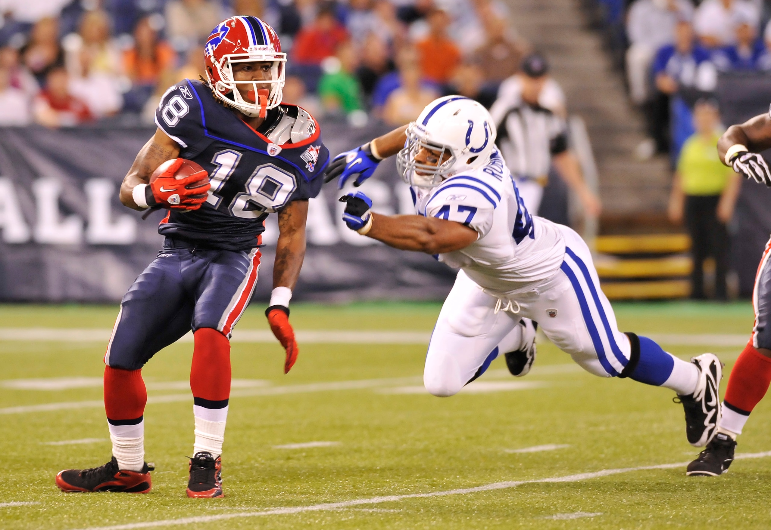 TORONTO - AUGUST 19:  Naaman Roosevelt #18 of the Buffalo Bills avoids the takle of Gijon Robinson #47 of the Indianapolis Colts during game action August 19, 2010 at the Rogers Centre in Toronto, Ontario, Canada. (Photo by Brad White/Getty Images)