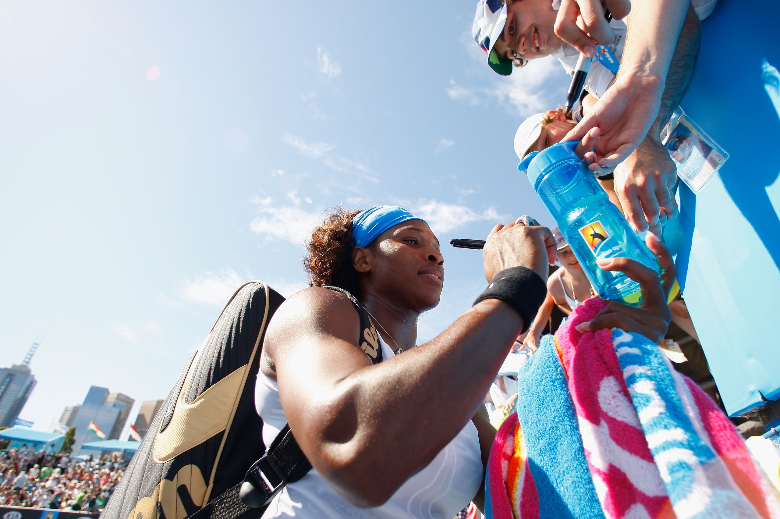 MELBOURNE, AUSTRALIA - JANUARY 21: Serena Williams of the United States of America signs autographs for fans in her first round doubles match with Venus Williams of the United States of America against Svetlana Kuznetsova of Russia and Nadia Petrova of R MELBOURNE, AUSTRALIA - JANUARY 21: Serena Williams of the United States of America signs autographs for fans in her first round doubles match with Venus Williams of the United States of America against Svetlana Kuznetsova of Russia and Nadia Petrova of R