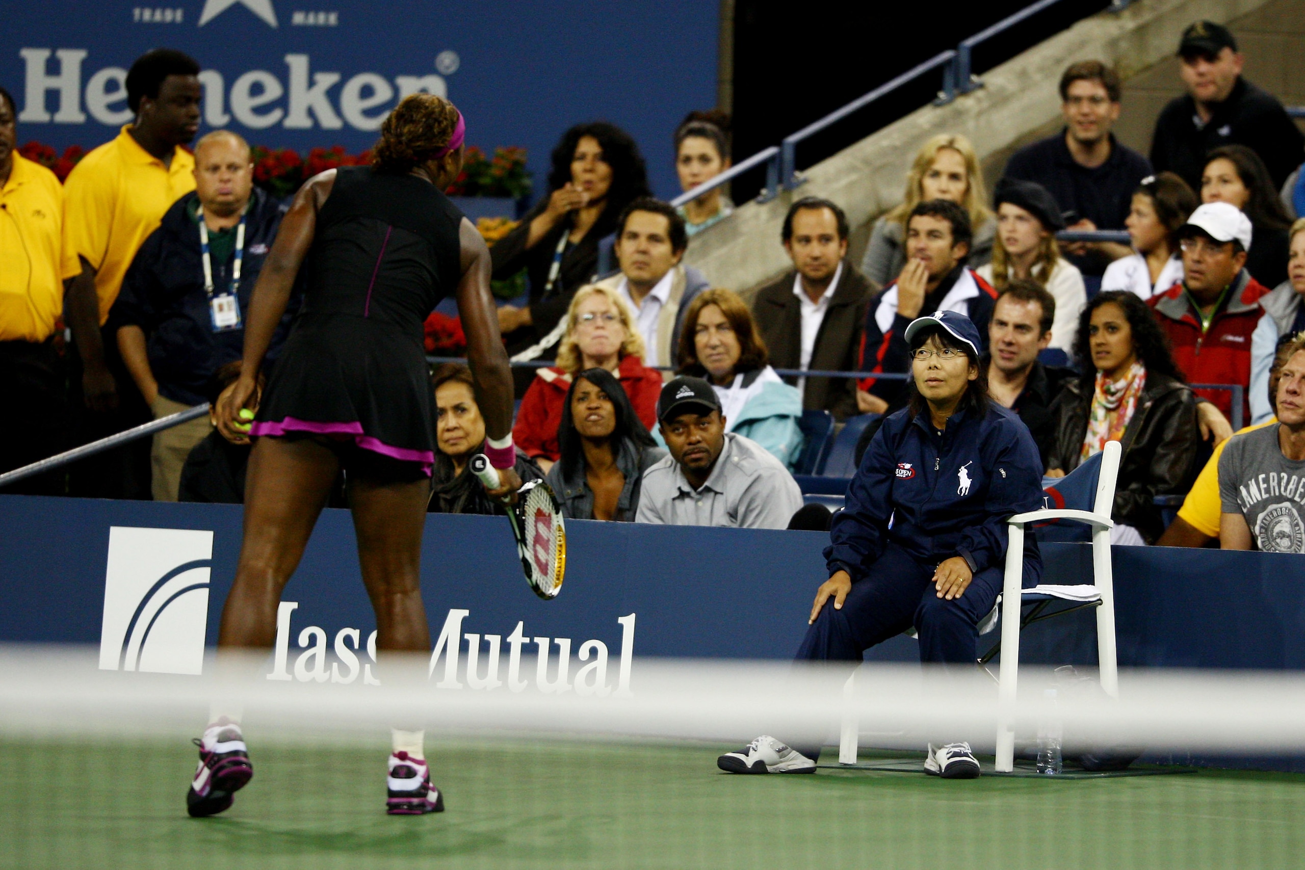 NEW YORK - SEPTEMBER 12: Serena Williams (L) argues with a line judge during her Women's Singles Semifinal match against Kim Clijsters of Belgium on day thirteen of the 2009 U.S. Open at the USTA Billie Jean King National Tennis Center on September 12, 2 NEW YORK - SEPTEMBER 12: Serena Williams (L) argues with a line judge during her Women's Singles Semifinal match against Kim Clijsters of Belgium on day thirteen of the 2009 U.S. Open at the USTA Billie Jean King National Tennis Center on September 12, 2