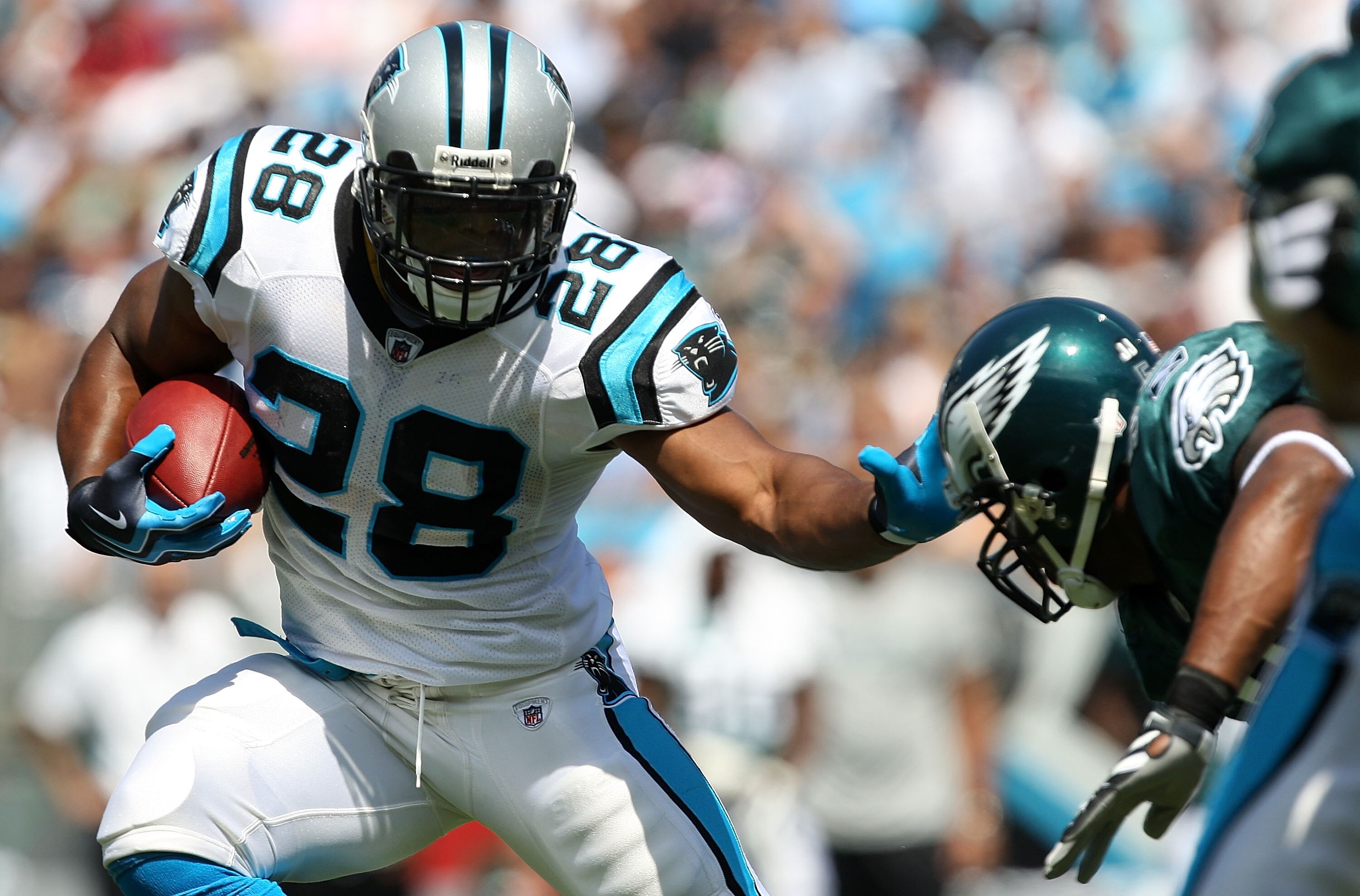 CHARLOTTE, NC - SEPTEMBER 13:  Running back Jonathan Stewart #28 of the Carolina Panthers rushes against the Philadelphia Eagles, during the second half of their NFL season opener at Bank of America Stadium on September 13, 2009 in Charlotte, North Caroli