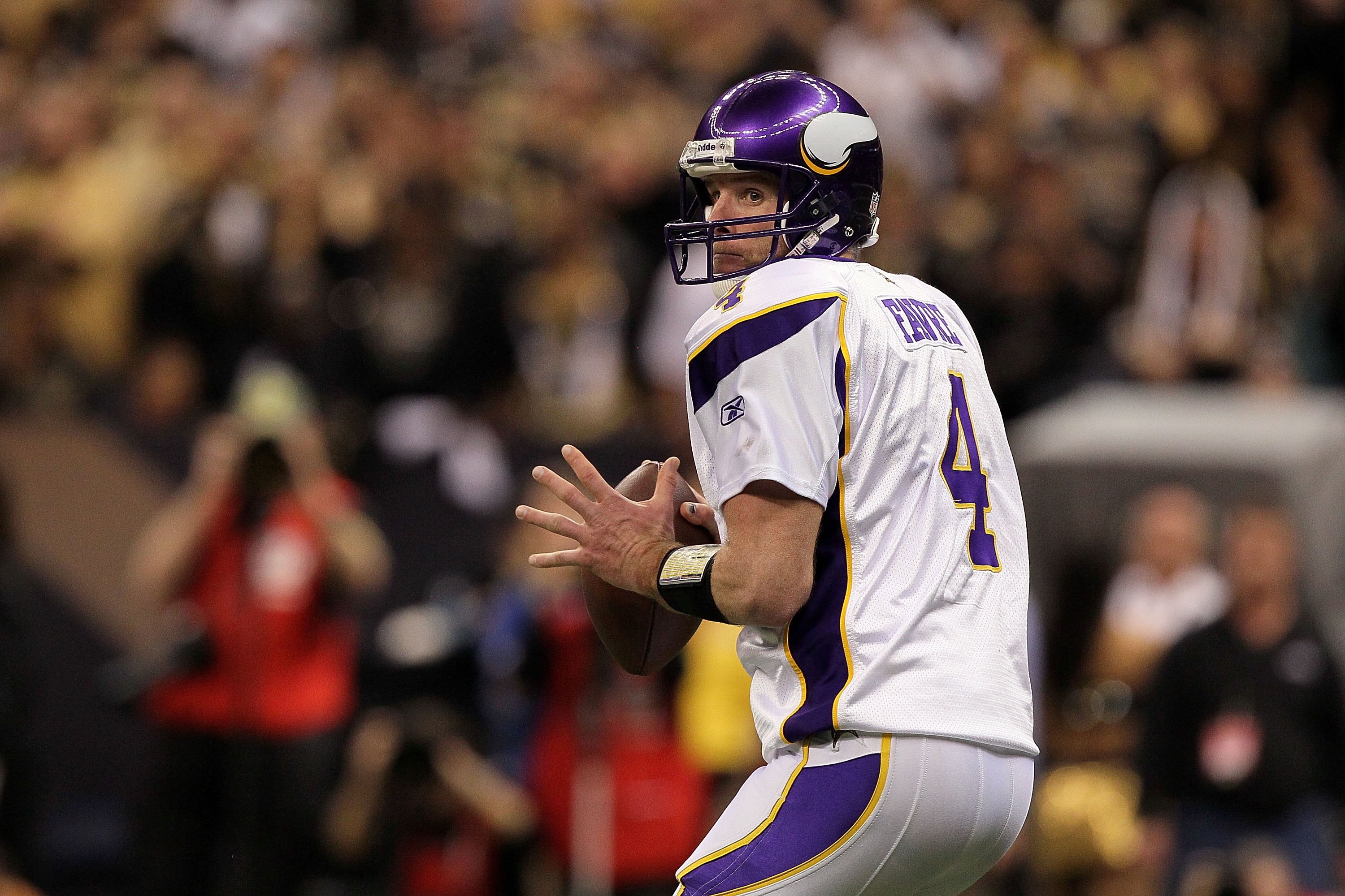 NEW ORLEANS - JANUARY 24:  Brett Favre #4 of the Minnesota Vikings looks to pass against the New Orleans Saints during the NFC Championship Game at the Louisiana Superdome on January 24, 2010 in New Orleans, Louisiana. The Saints won 31-28.  (Photo by Jed