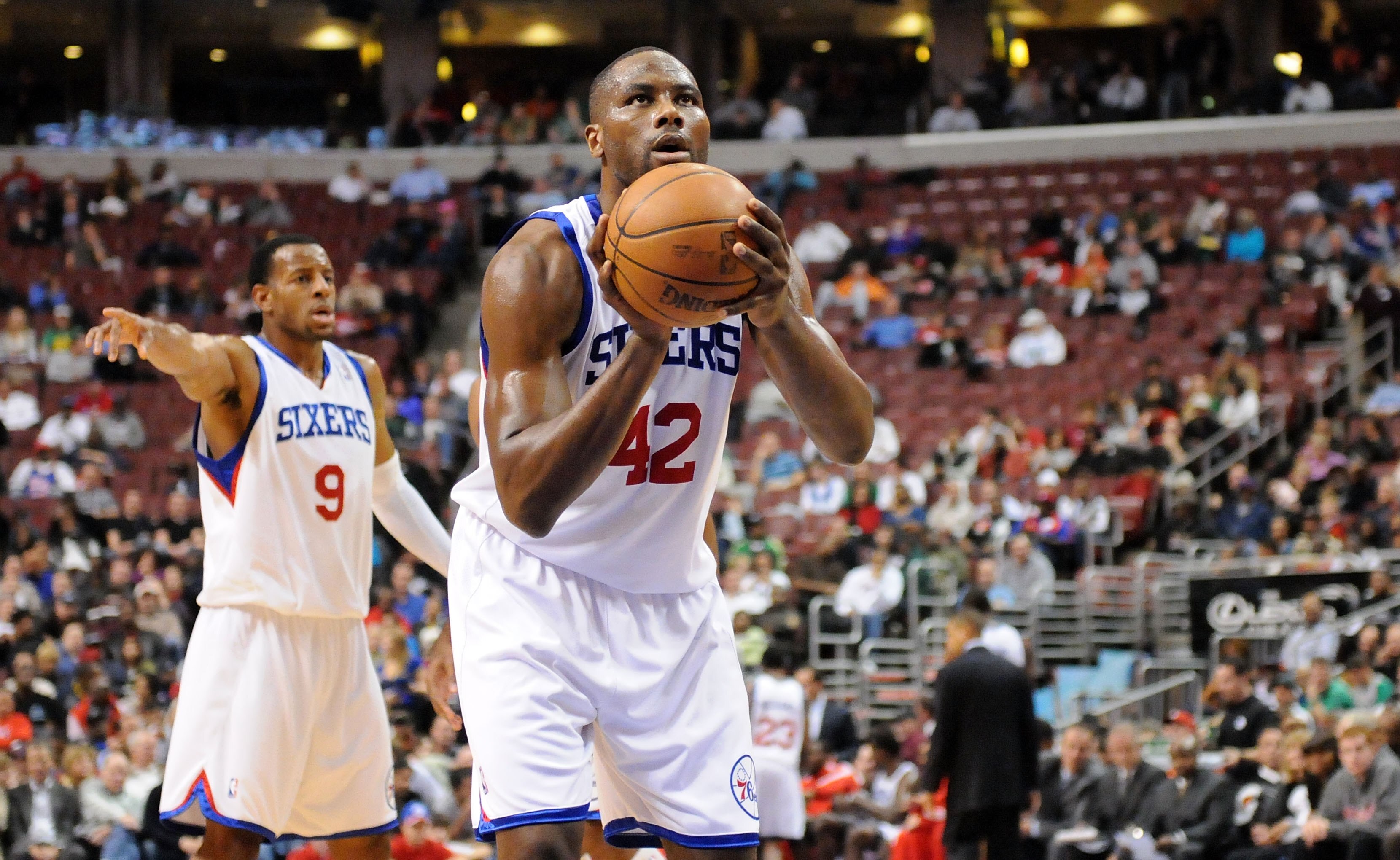 PHILADELPHIA - NOVEMBER 03:  Elton Brand #42 of the Philadelphia 76ers gets set to shoot a free throw as Andre Iguodala #9 gestures to a teammate against the Boston Celtics at the Wachovia Center on November 3, 2009 in Philadelphia, Pennsylvania.  NOTE TO