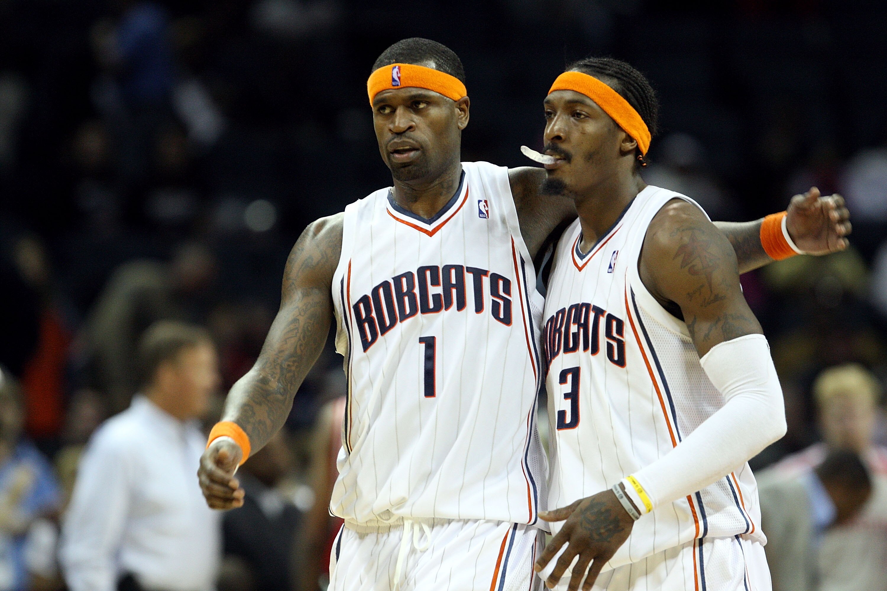 CHARLOTTE, NC - JANUARY 12:  Teammates Stephen Jackson #1 and Gerald Wallace #3 of the Charlotte Bobcats celebrate after a 102-94 victory over the Houston Rockets at Time Warner Cable Arena on January 12, 2010 in Charlotte, North Carolina.  NOTE TO USER: