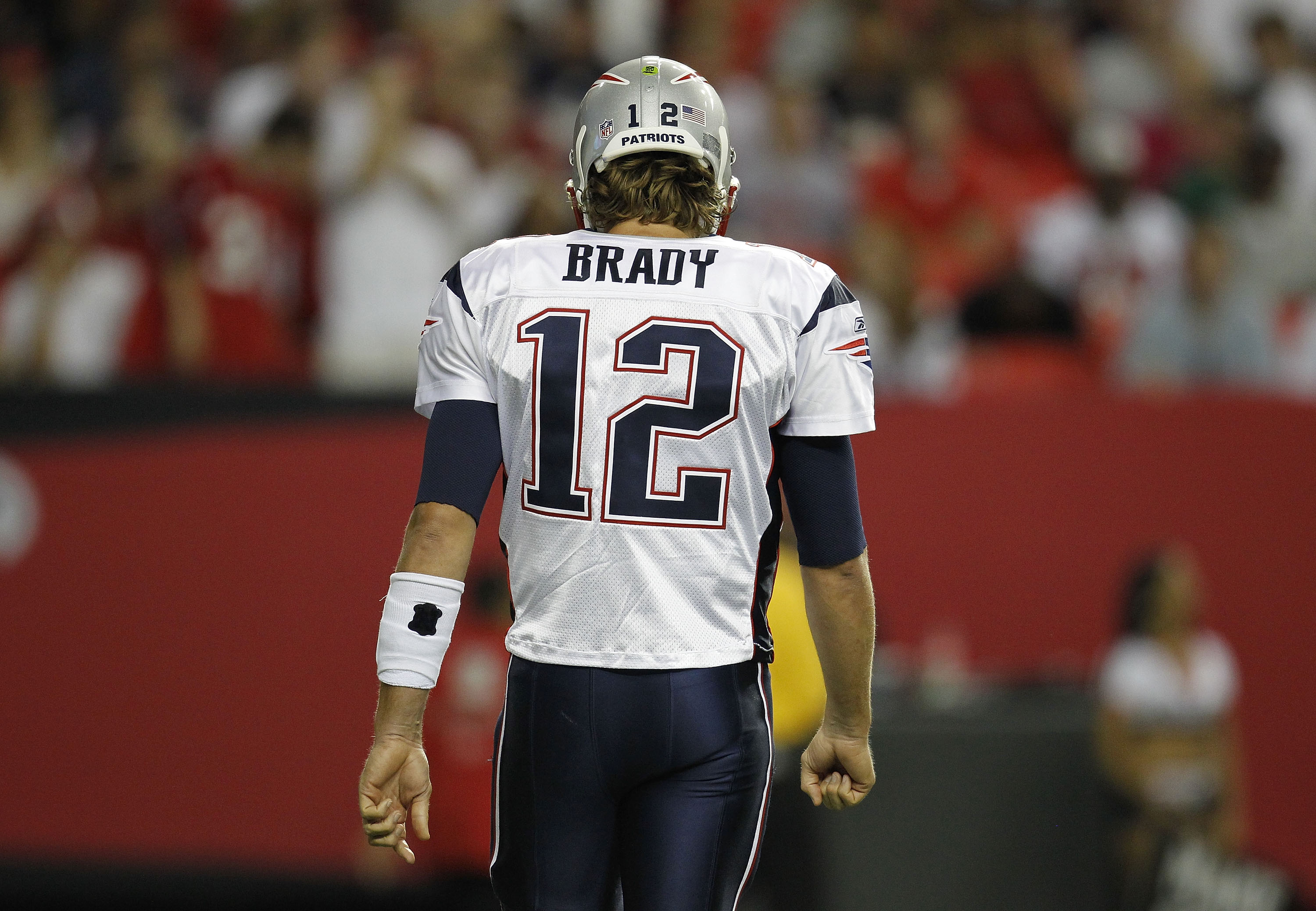 ATLANTA - AUGUST 19:  Quarterback Tom Brady #12 of the New England Patriots walks to the bench during the preseason game against the Atlanta Falcons at the Georgia Dome on August 19, 2010 in Atlanta, Georgia.  The Patriots beat the Falcons 28-10.  (Photo
