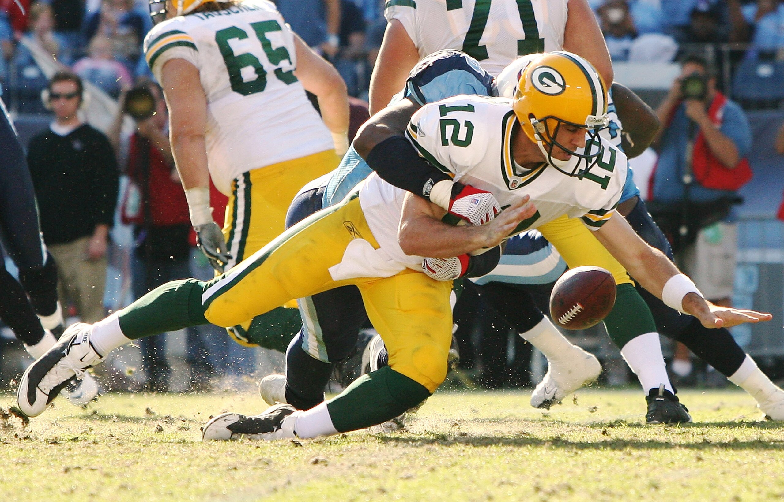 NASHVILLE, TN - NOVEMBER 02: Defensive end Jacob Ford #78 of the Tennessee Titans cause a fumble when he sacks quarterback Aaron Rodgers #12 of the Green Bay Packers at LP Field on November 2, 2008 in Nashville, Tennessee. The Titans defeated the Packers 