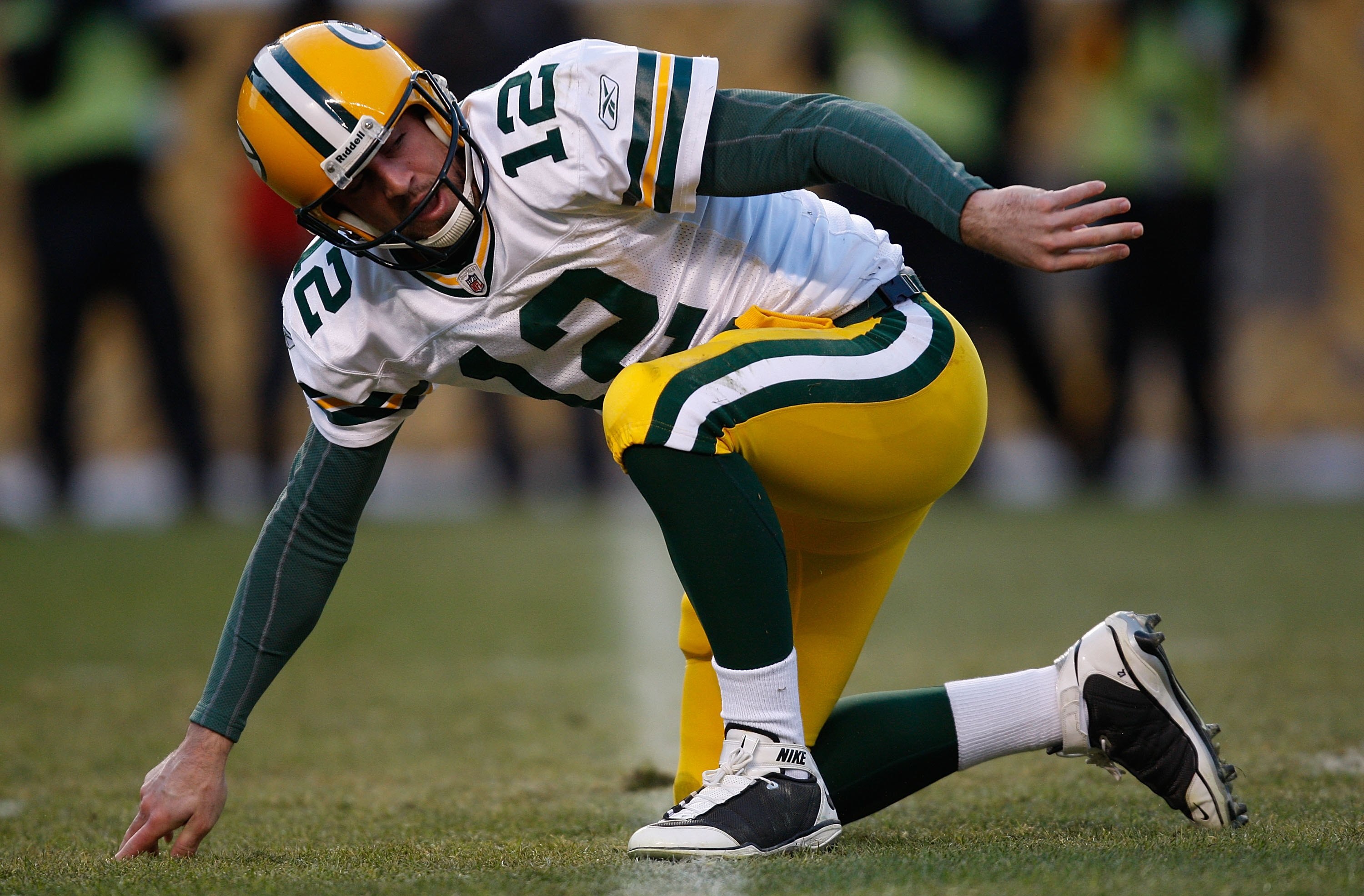 PITTSBURGH - DECEMBER 20: Aaron Rodgers #12 of the Green Bay Packers calls off the medical staff after being sacked during the game against the Pittsburgh Steelers on December 20, 2009 at Heinz Field in Pittsburgh, Pennsylvania. (Photo by Jared Wickerham/