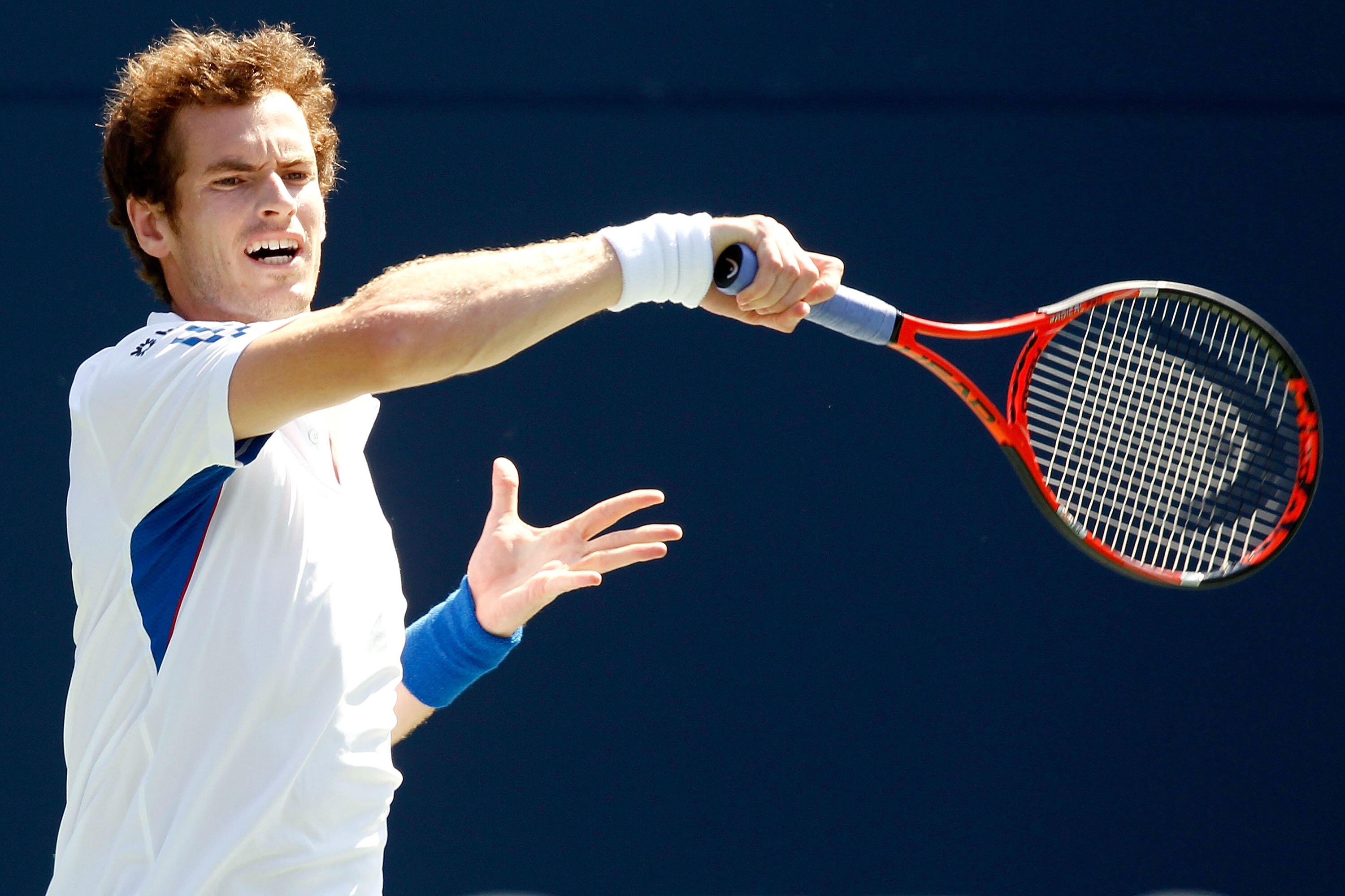 TORONTO, ON - AUGUST 12:  Andy Murray of Great Britain returns a shot to Gael Monfils of France during the Rogers Cup at the Rexall Centre on August 12, 2010 in Toronto, Canada.  (Photo by Matthew Stockman/Getty Images)