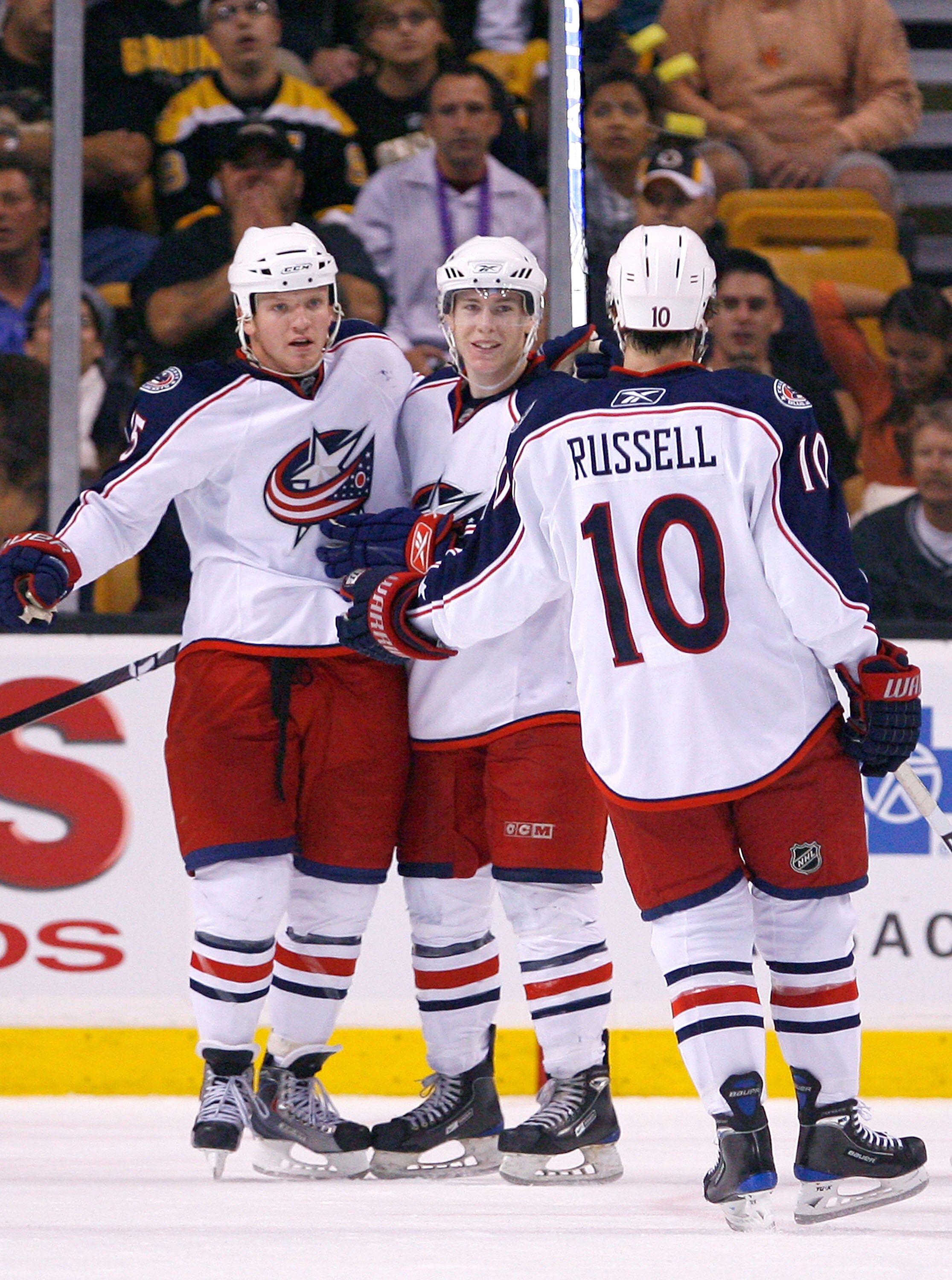 BOSTON, MA - SEPTEMBER 26:  Derek Dorsett #15 of the Columbus Blue Jackets celebrates his goal with his teammates Matt Calvert #69 and Kris Russell #10 against the Boston Bruins during a preseason game at the TD Banknorth Garden on September 26, 2009 in B