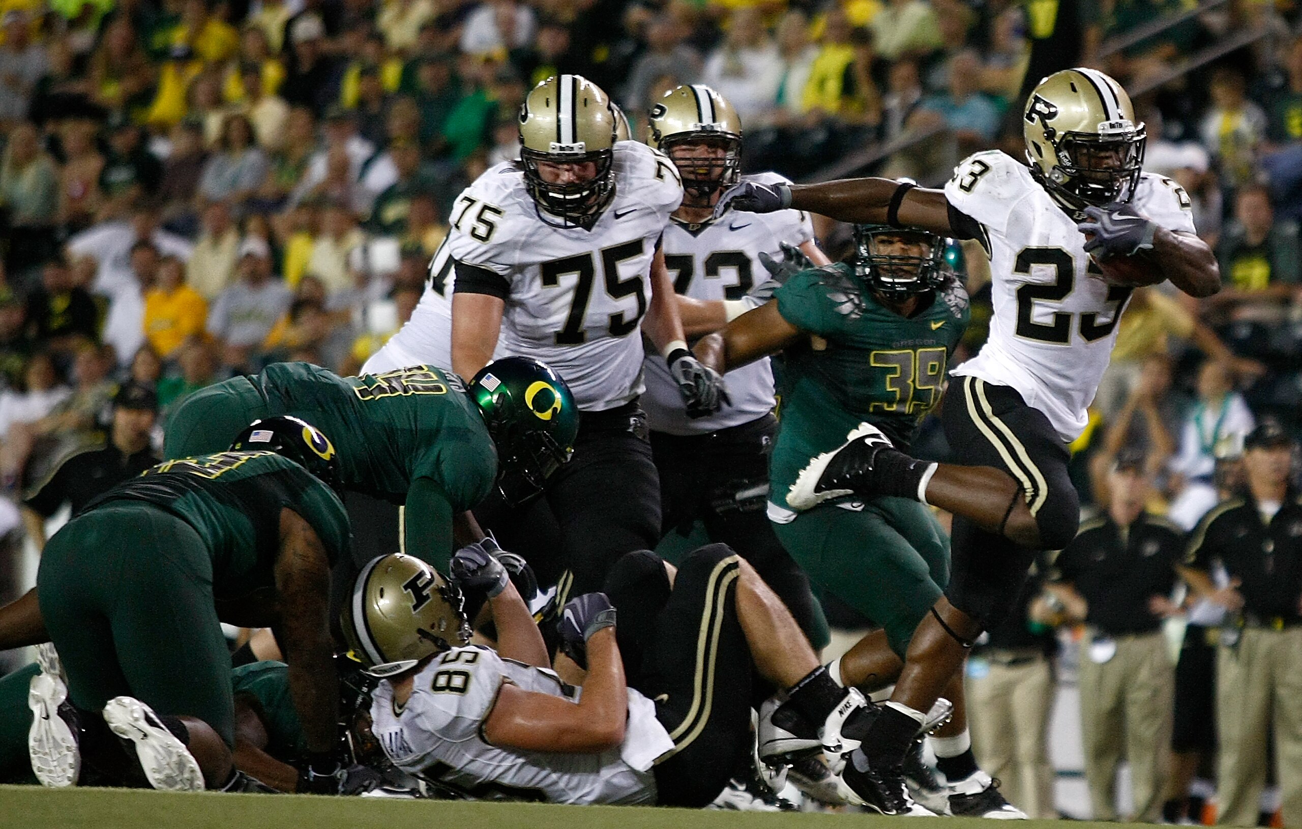 EUGENE, OR - SEPTEMBER 12:   Ralph Bolden #23 of the Purdue Boilermakers runs the ball against the Oregon Ducks at Autzen Stadium on September 12, 2009 in Eugene, Oregon.  (Photo by Jonathan Ferrey/Getty Images)