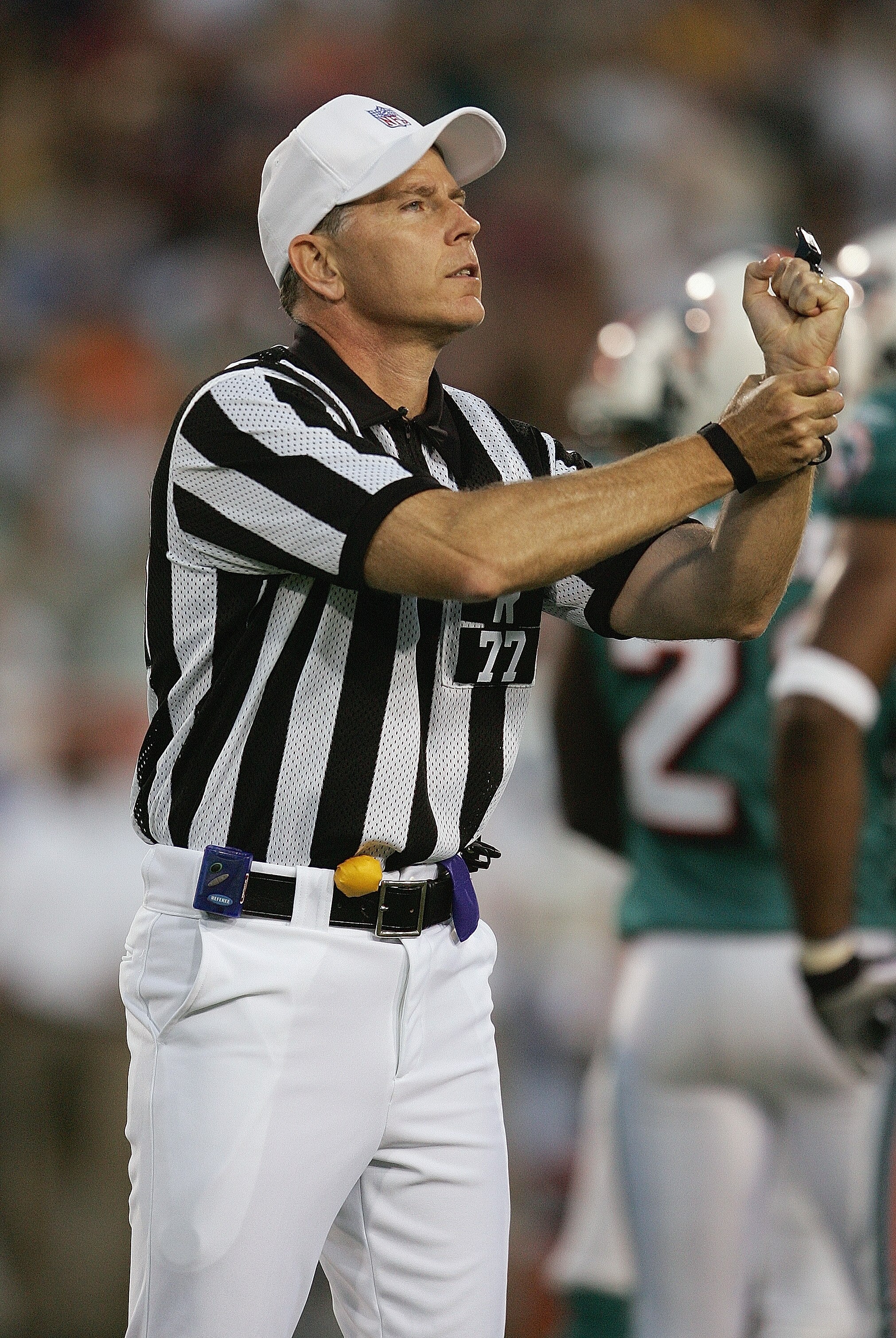 CANTON, OH - AUGUST 8:  Referee Terry McAulay calls a holding penalty during the NFL Hall of Fame pre-season game between the Miami Dolphins and Chicago Bears at Fawcett Stadium on August 8, 2005 in Canton, Ohio. The Bears defeated the Dolphins 27-24. (Ph