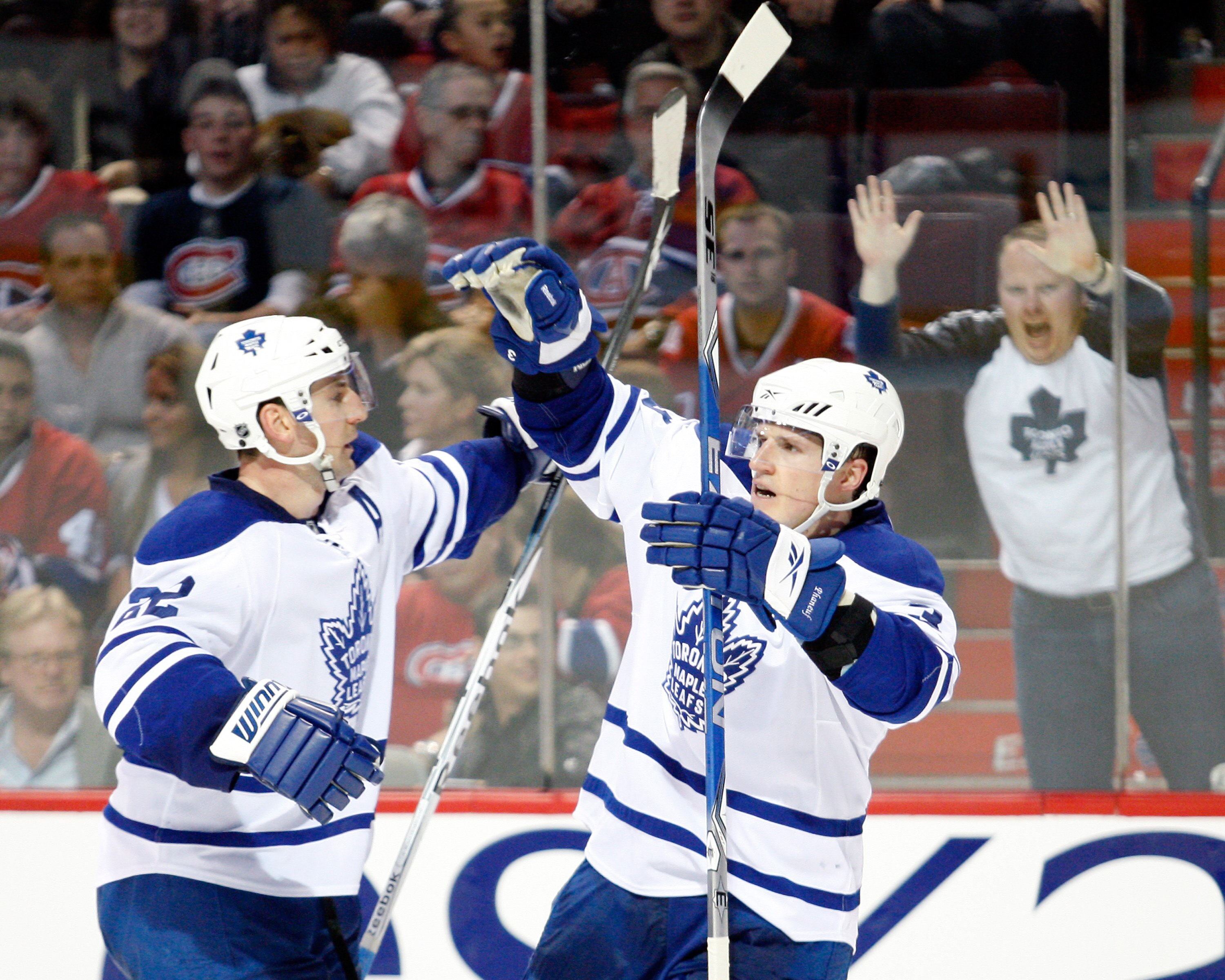 MONTREAL- APRIL 10:  Dion Phaneuf #3 celebrates his game winning goal with Francois Beauchemin #22 of the Toronto Maple Leafs during the NHL game on April 10, 2010 at the Bell Centre in Montreal, Quebec, Canada.  The Maple Leafs the Canadiens 4-3 in overt