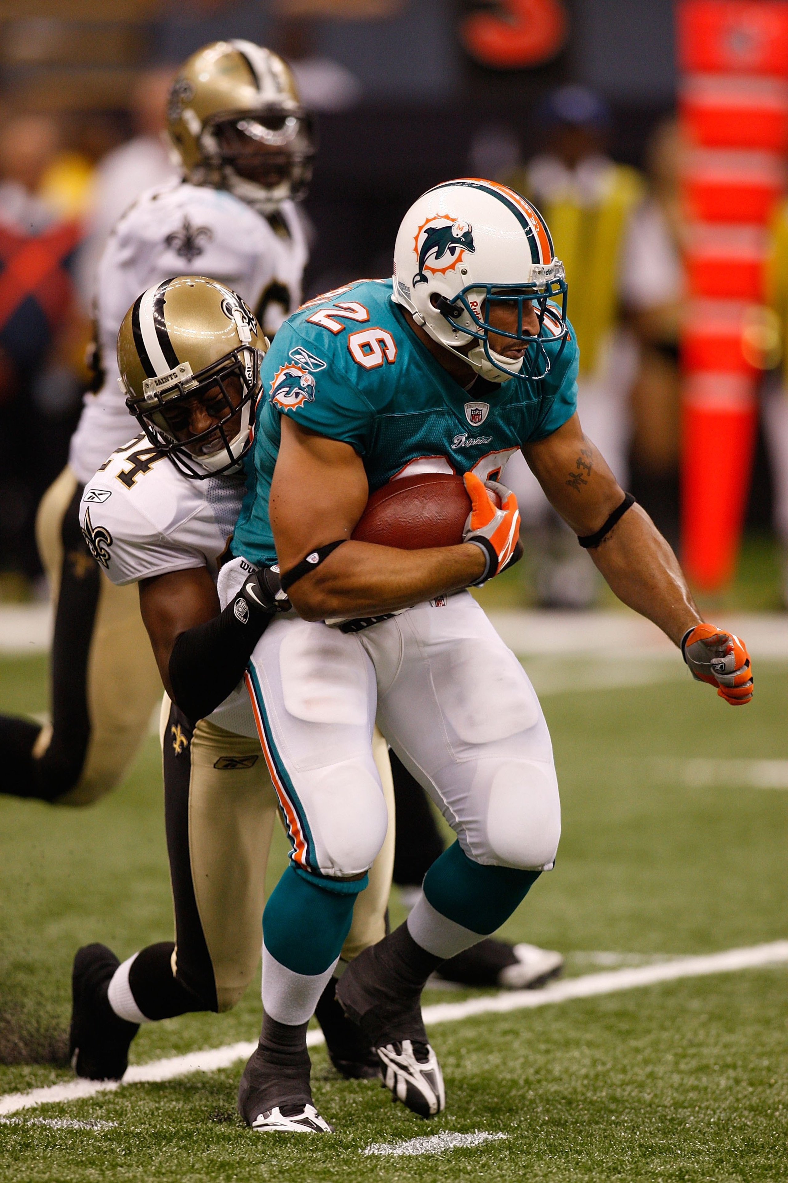 NEW ORLEANS - SEPTEMBER 03:  Lex Hilliard #26 of the Miami Dolphins during the game against the New Orleans Saints at the Louisiana Superdome on September 3, 2009 in New Orleans, Louisiana.  (Photo by Chris Graythen/Getty Images)